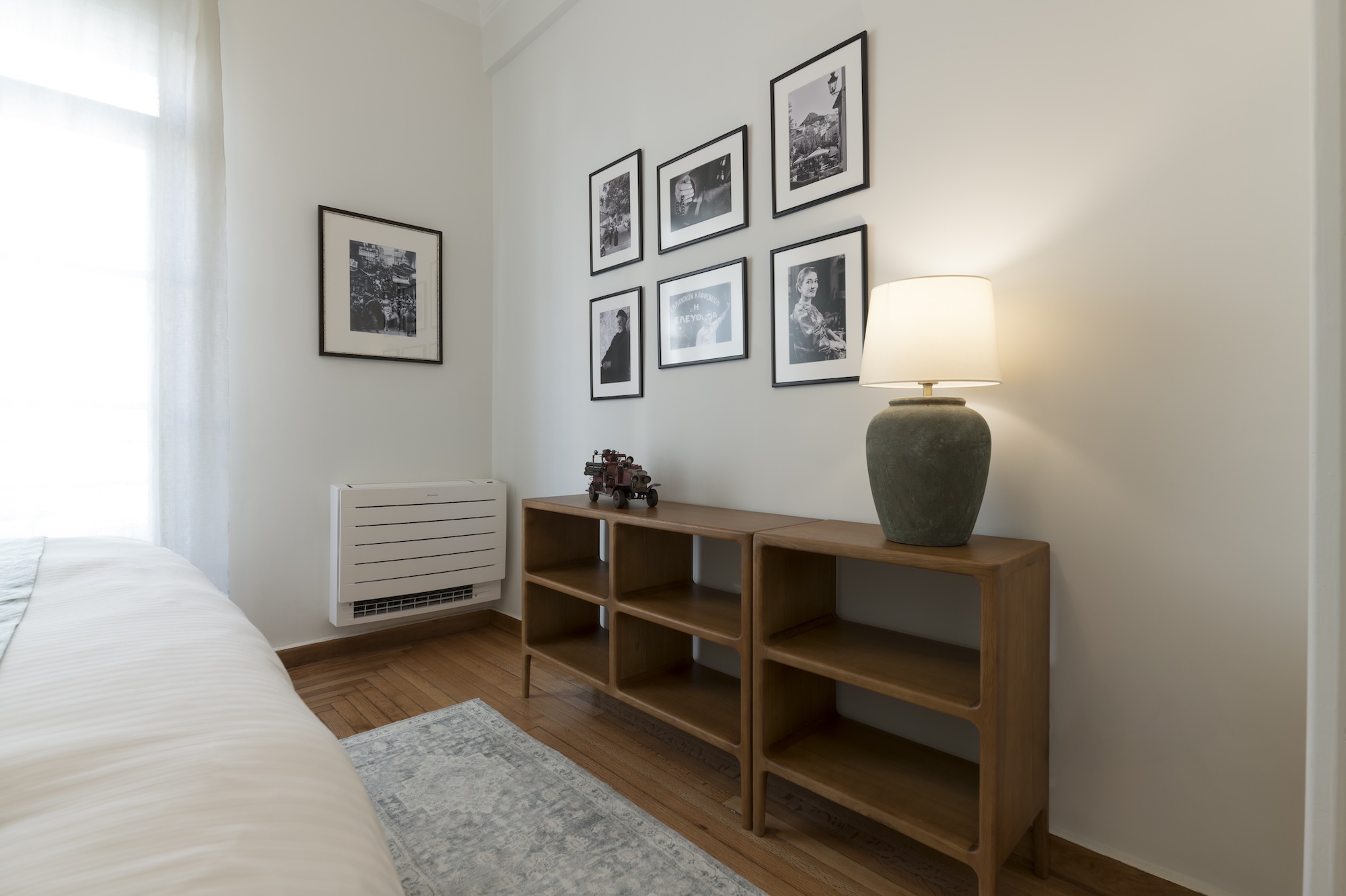 Bedroom console table and gallery wall at The Hive apartment in Kypseli Athens