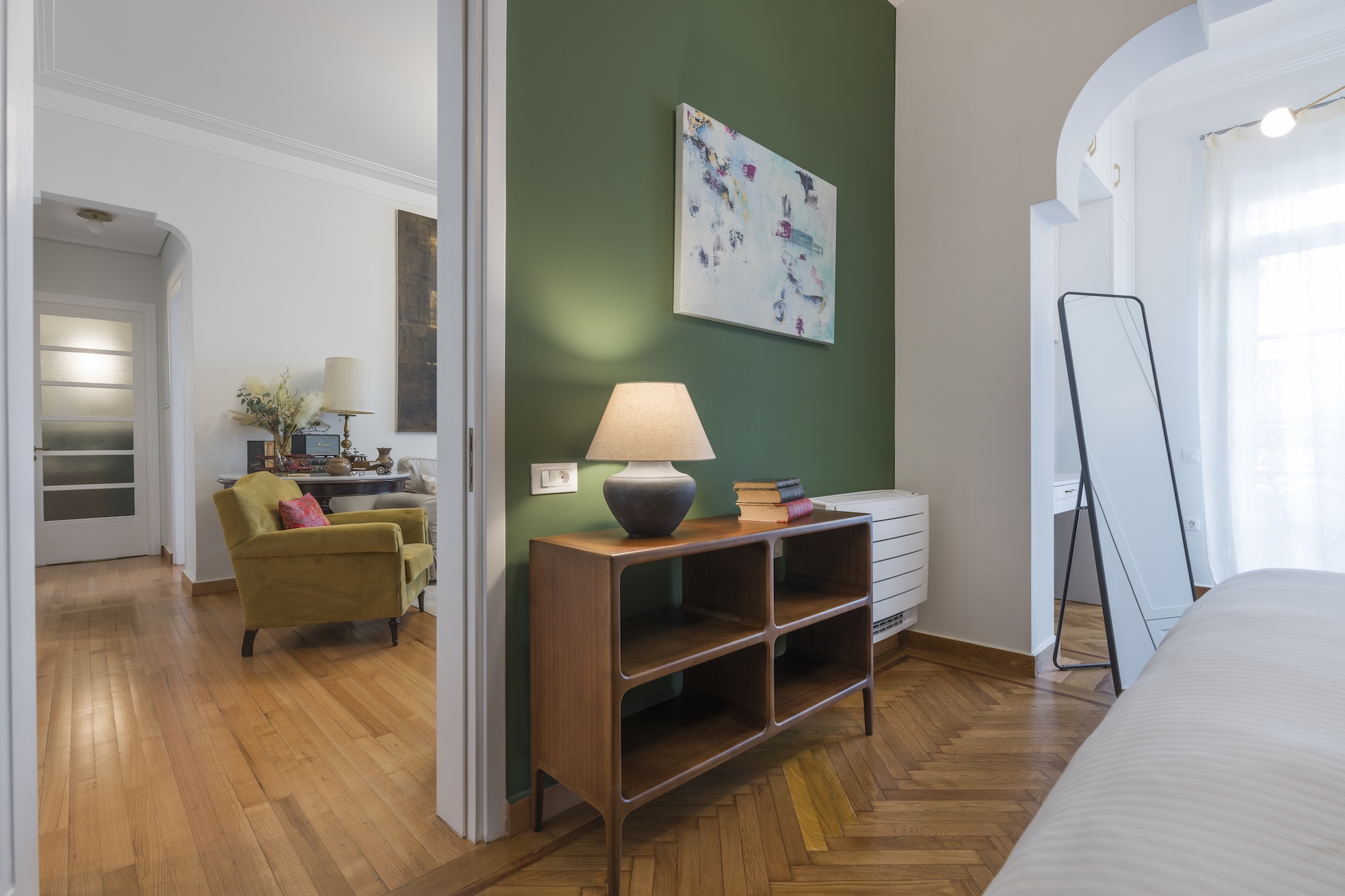 Bedroom seating and storage area at The Hive apartment in Kypseli Athens