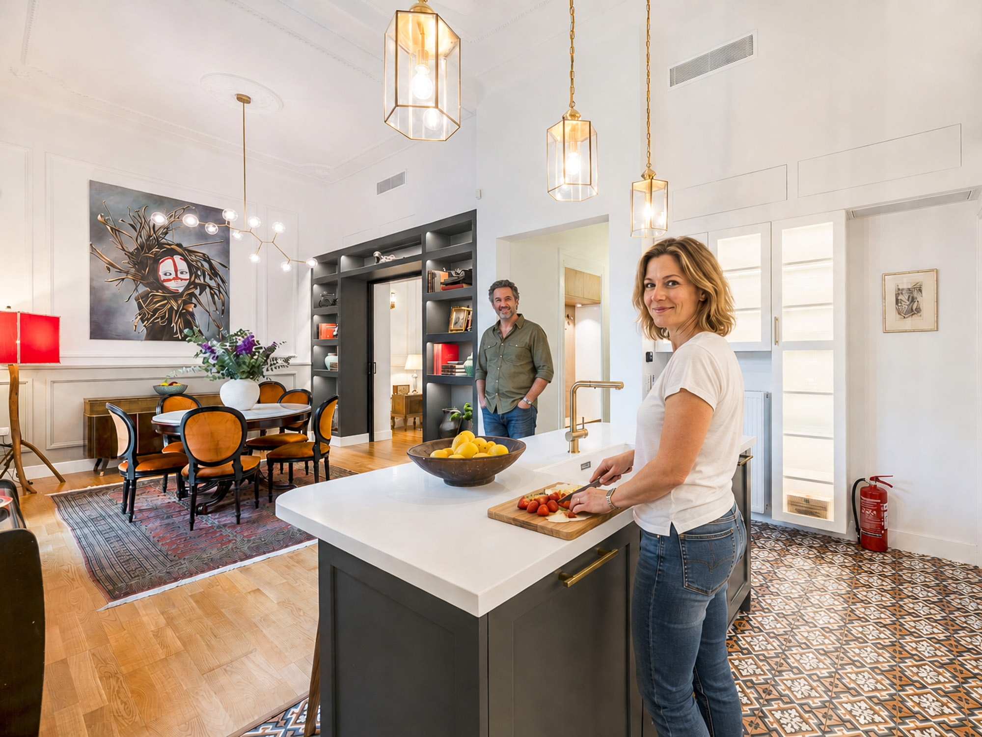 Open-plan kitchen and dining area at Silk House in Athens, showing restored neoclassical features and contemporary guest comforts.
