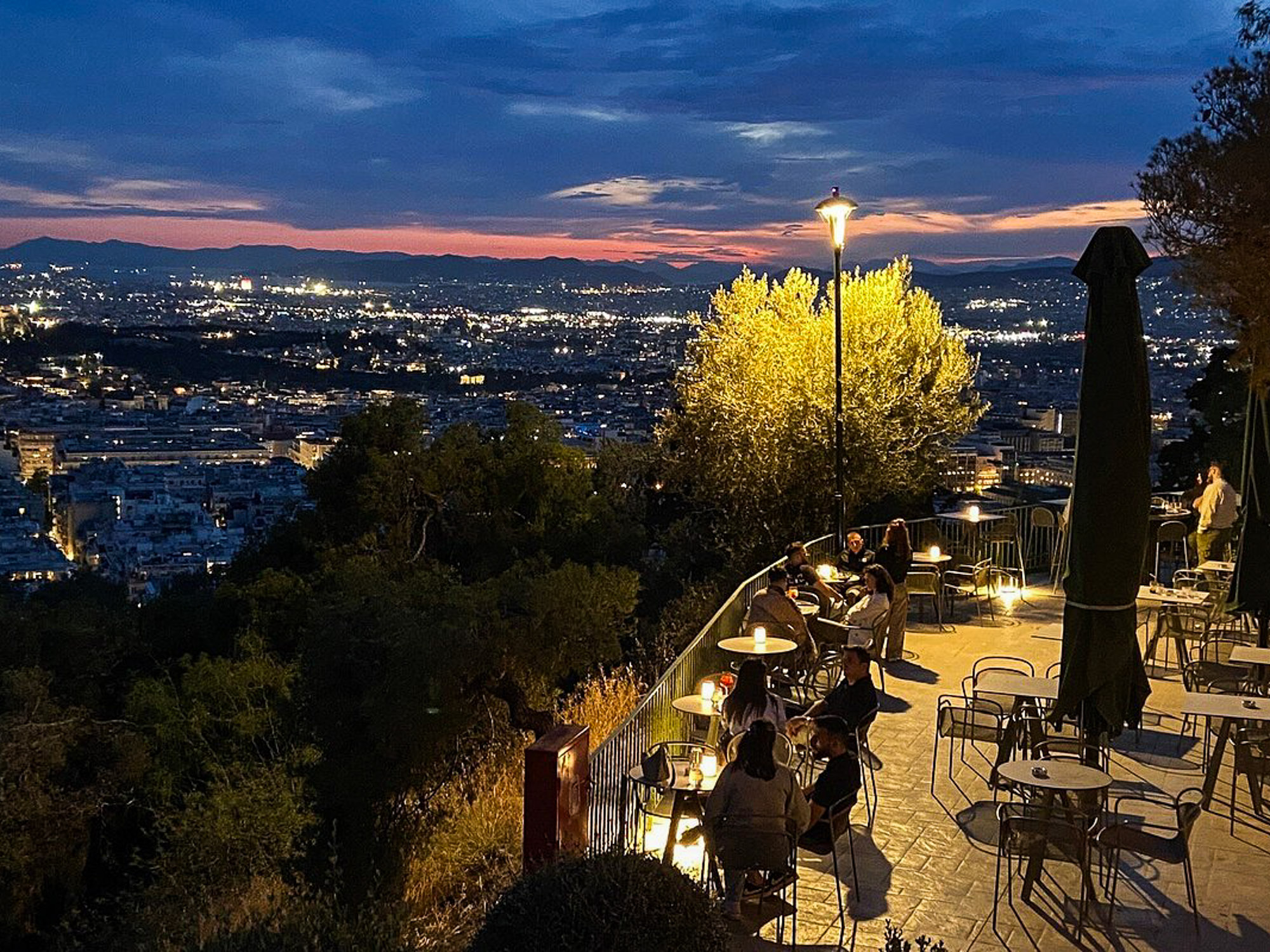 Sunset and night lights of Athens seen from Prasini Tenta on Lycabettus Hill