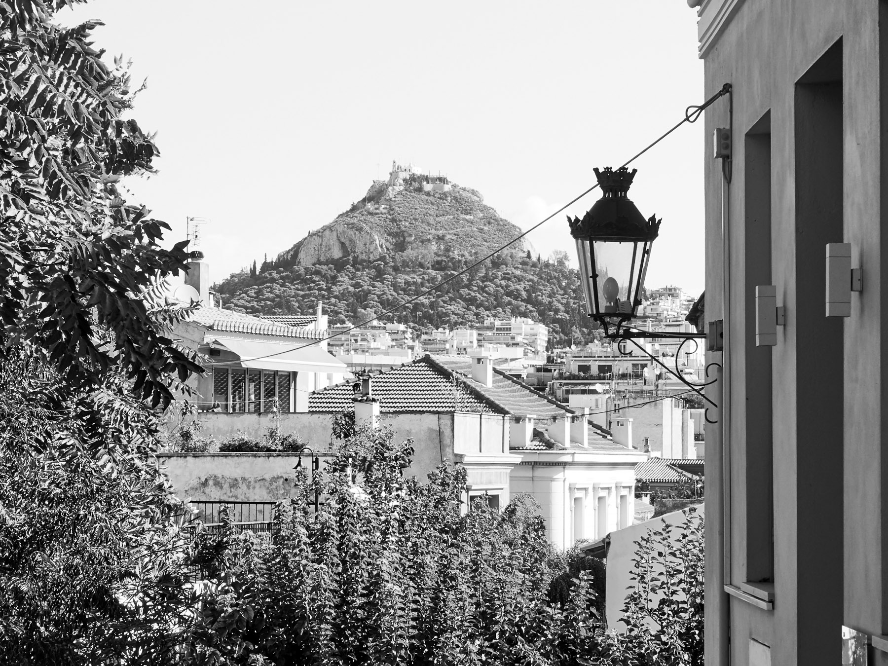 Black and white view of Lycabettus Hill, taken from a street in nearby neighbourhood