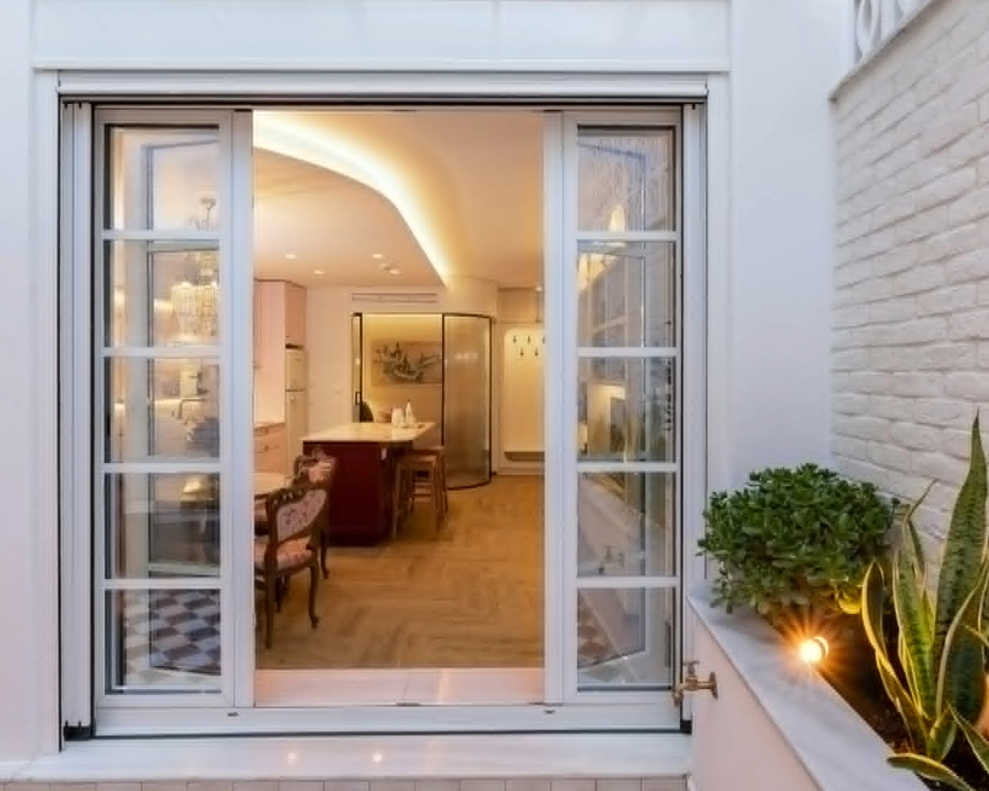 Private terrace and open glass doors at The Hill residence in Lycabettus, Athens