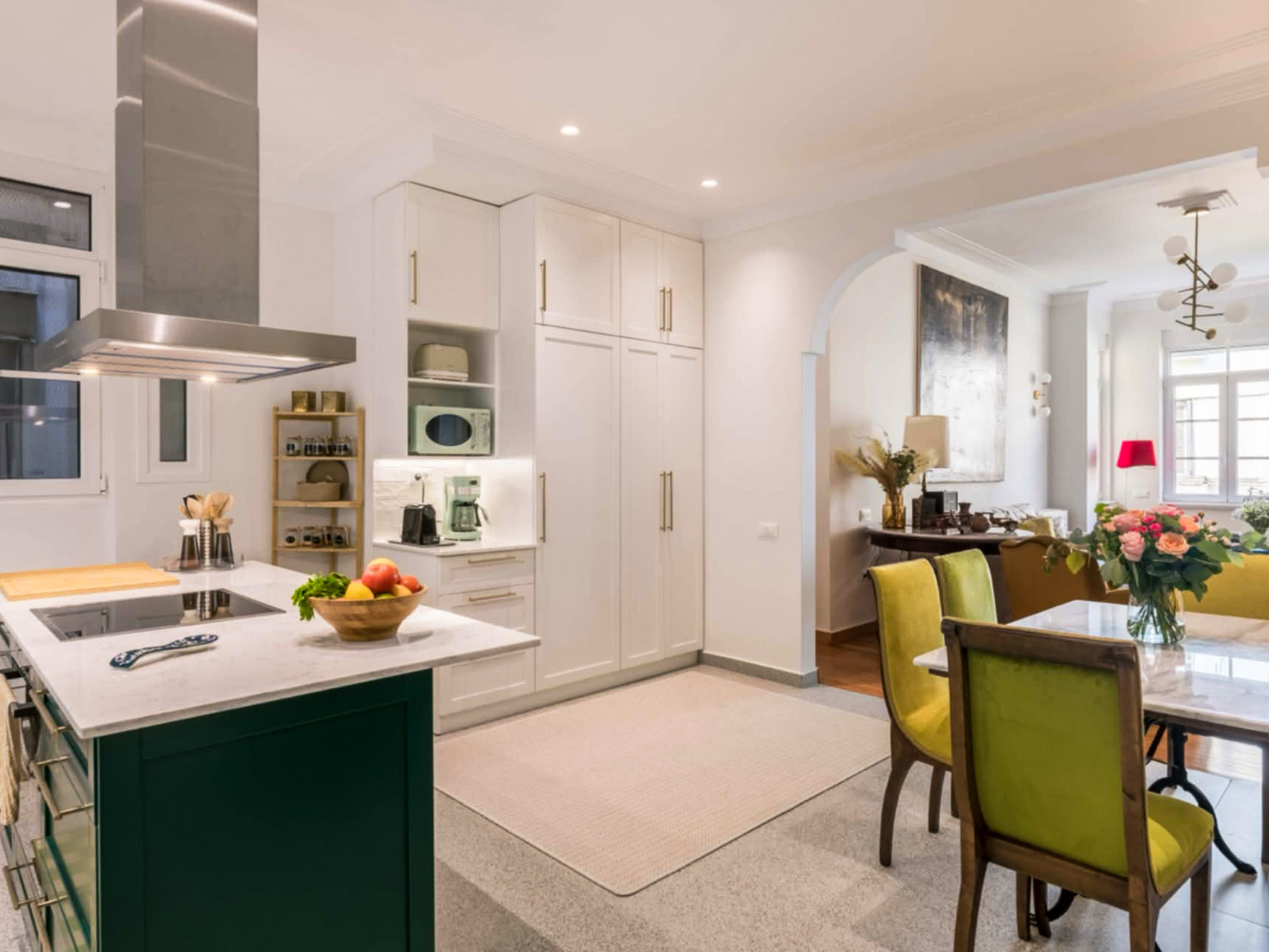 Open-plan kitchen and dining area at The Hive apartment in Kypseli, Athens