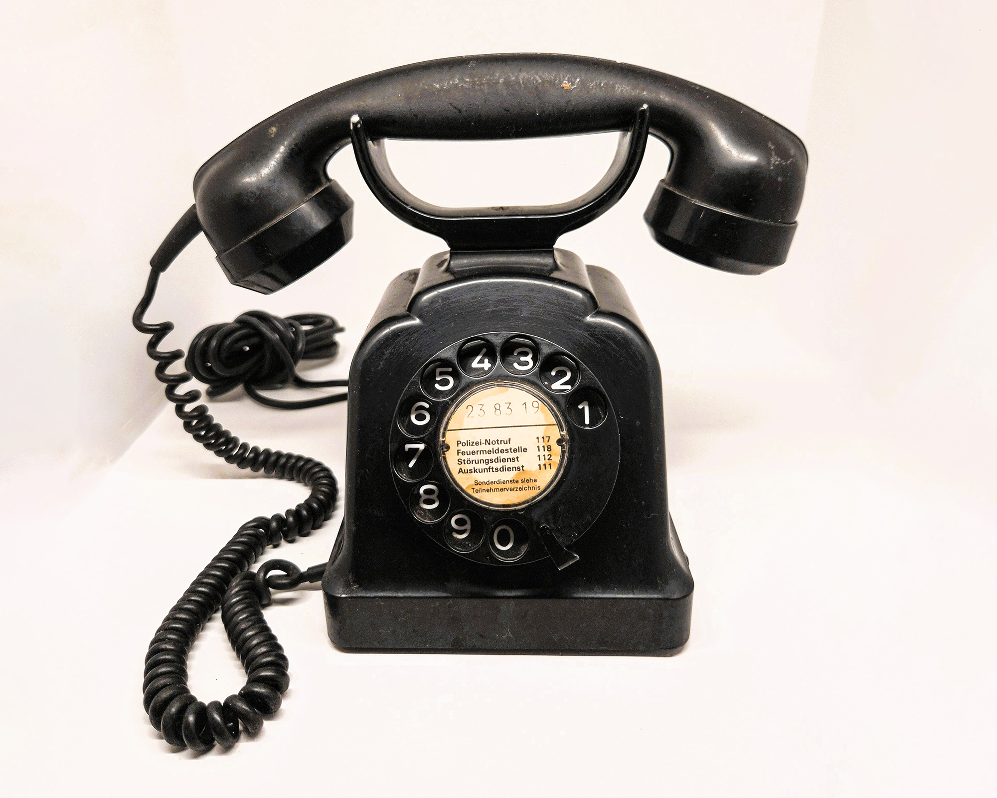 Black rotary telephone in a vintage-inspired room at Silk House in Metaxourgeio, Athens.