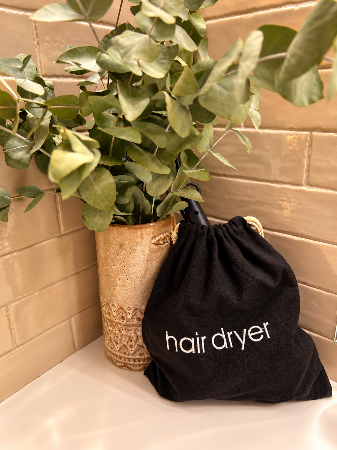 Hairdryer provided for guests in a Halo Collection bathroom in Athens