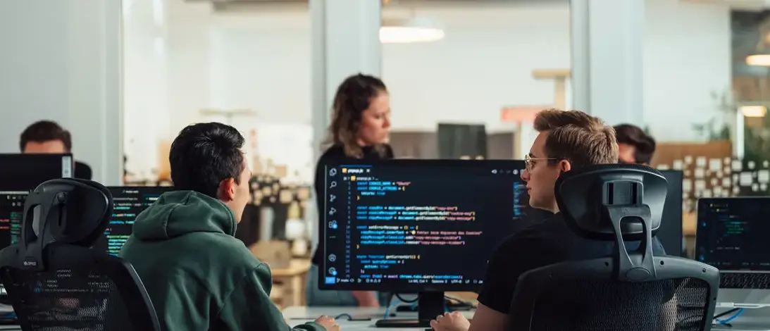 Two developers working in the AOE office in Wiesbaden