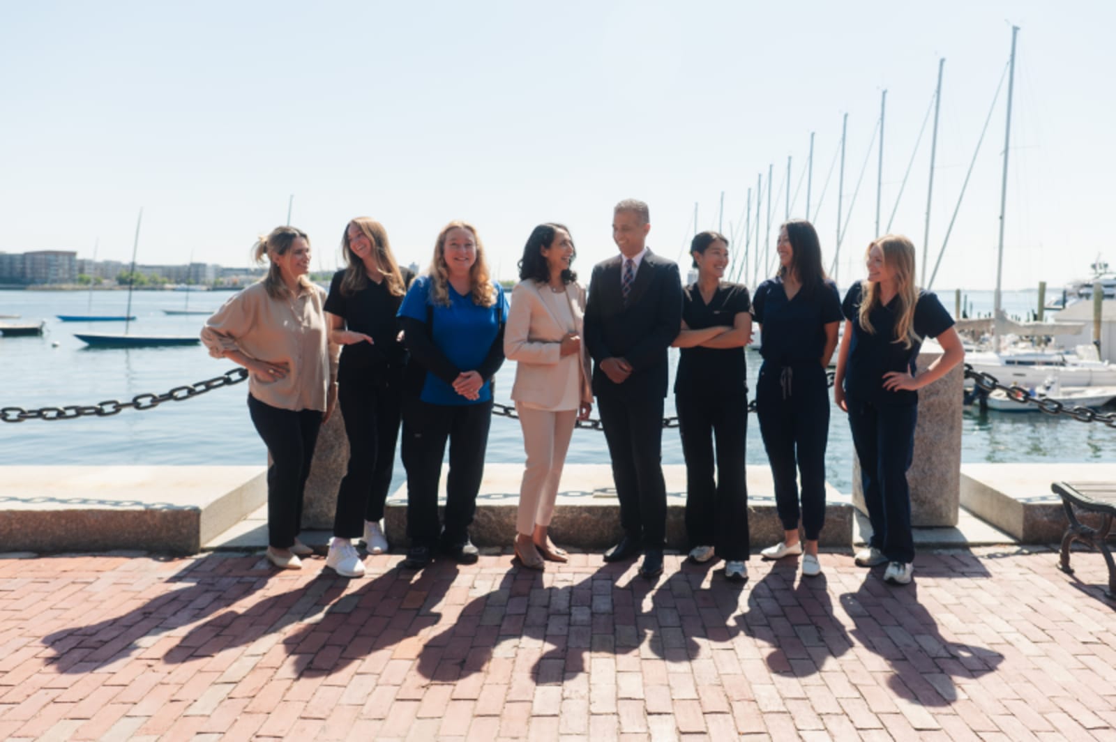Lewis Wharf Dental team standing together outdoors by waterfront