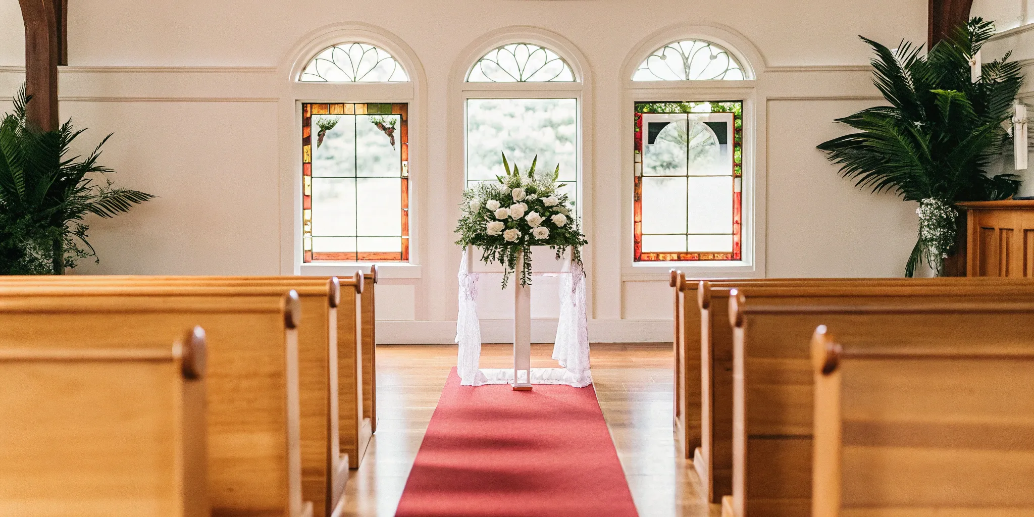 Church altar prepared for a Christian wedding ceremony and the couple's vows.