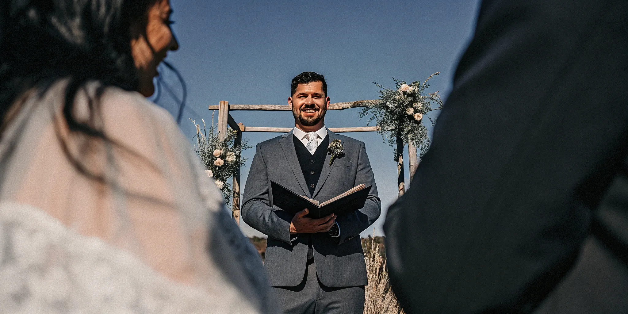 A friend legally marrying a couple as their wedding officiant.