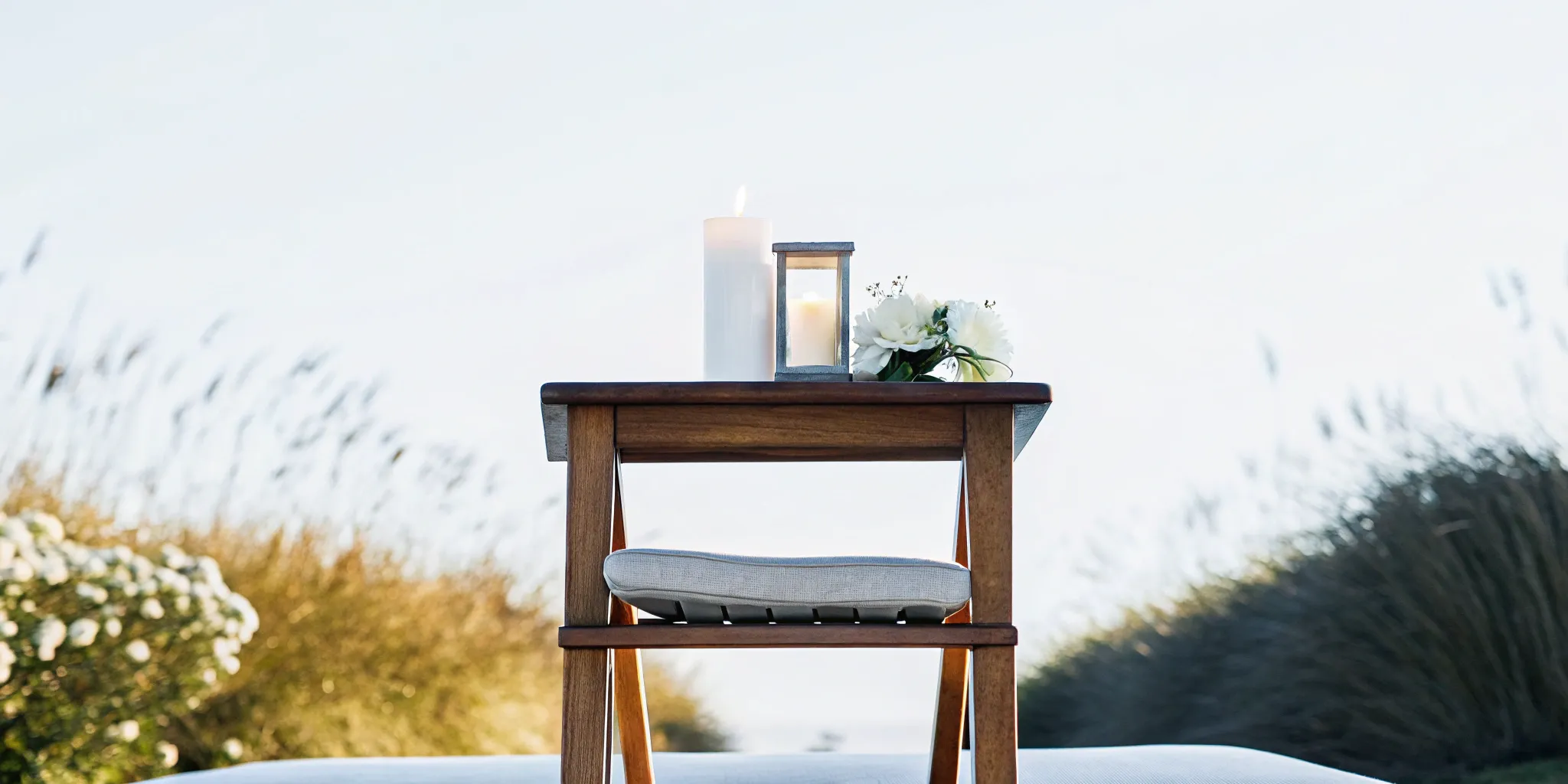 Outdoor table with candles and flowers for a guide on how to become an interfaith minister.
