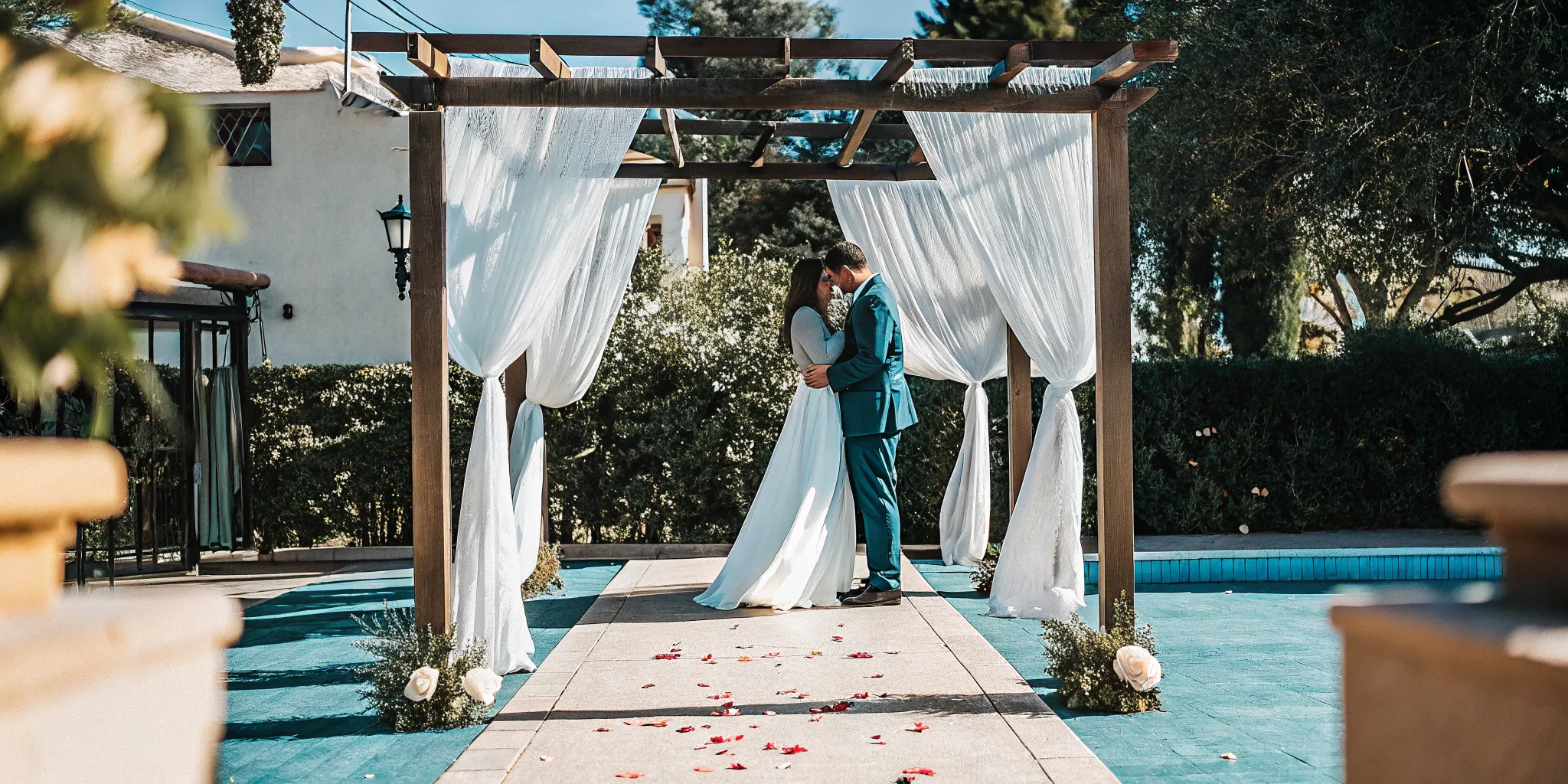 A romantic wedding ceremony script in action as a couple embraces under an arch.