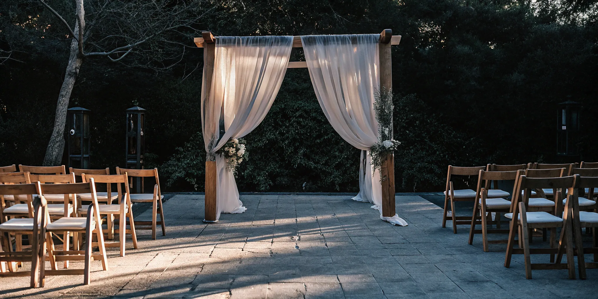 Wedding ceremony with a wooden arch prepared for a non-denominational officiant's script.