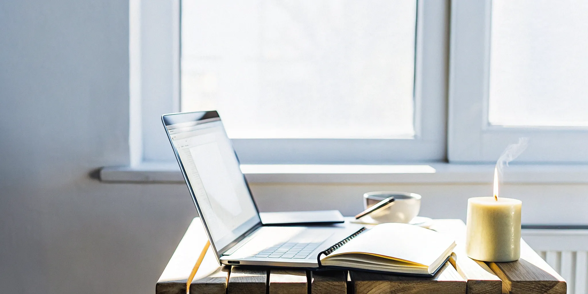 Preparing for an online ordination in Pennsylvania with a laptop and notebook.