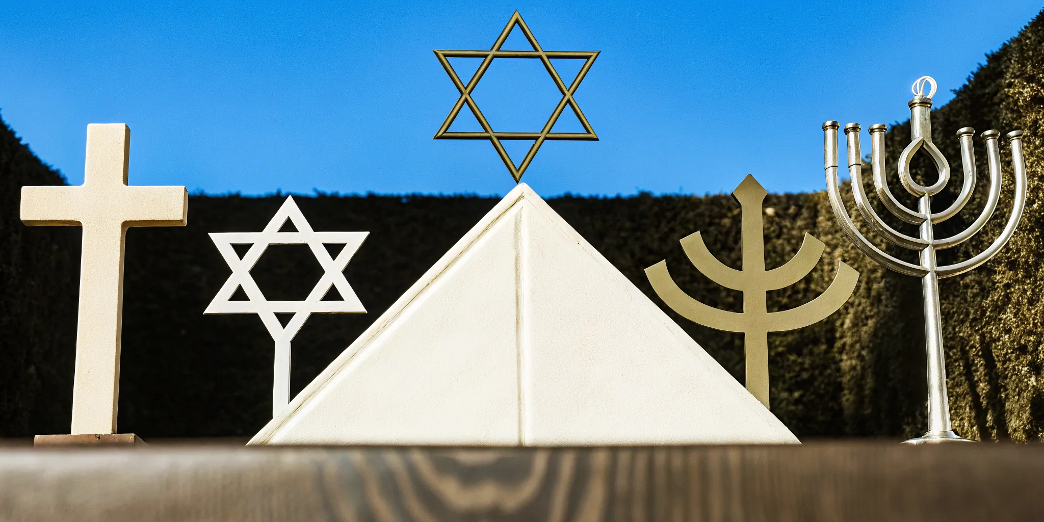 Religious symbols from various faiths for meaningful unity ceremony ideas.