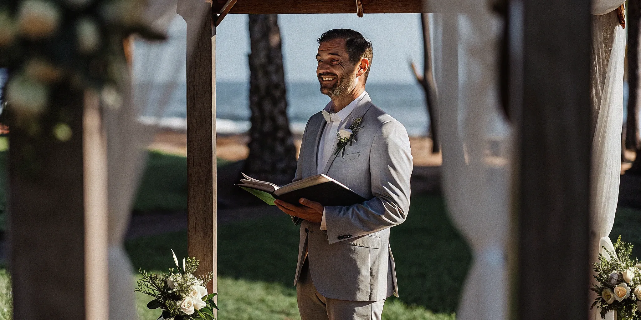 Wedding officiant prepares for an outdoor ceremony.