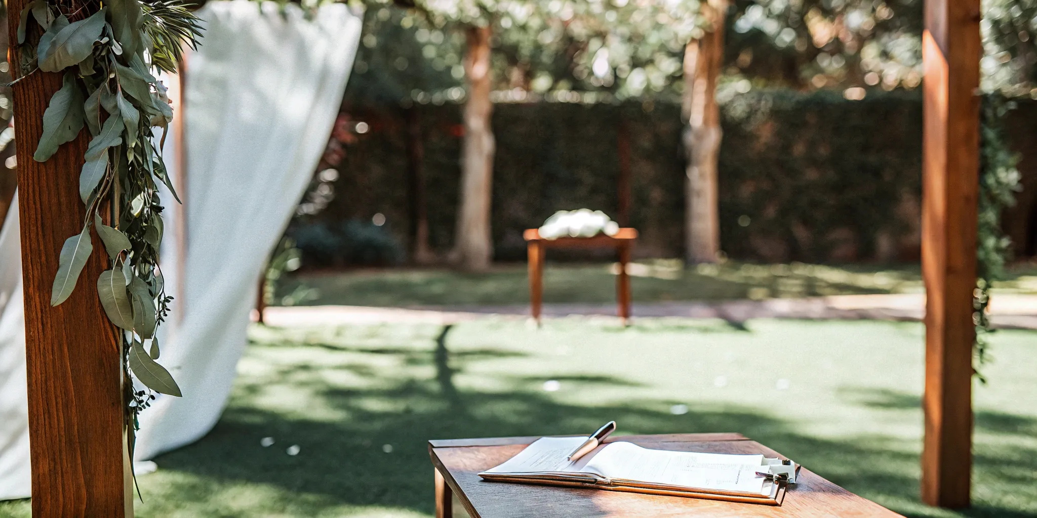 Writing a non-religious wedding ceremony script at an outdoor table.