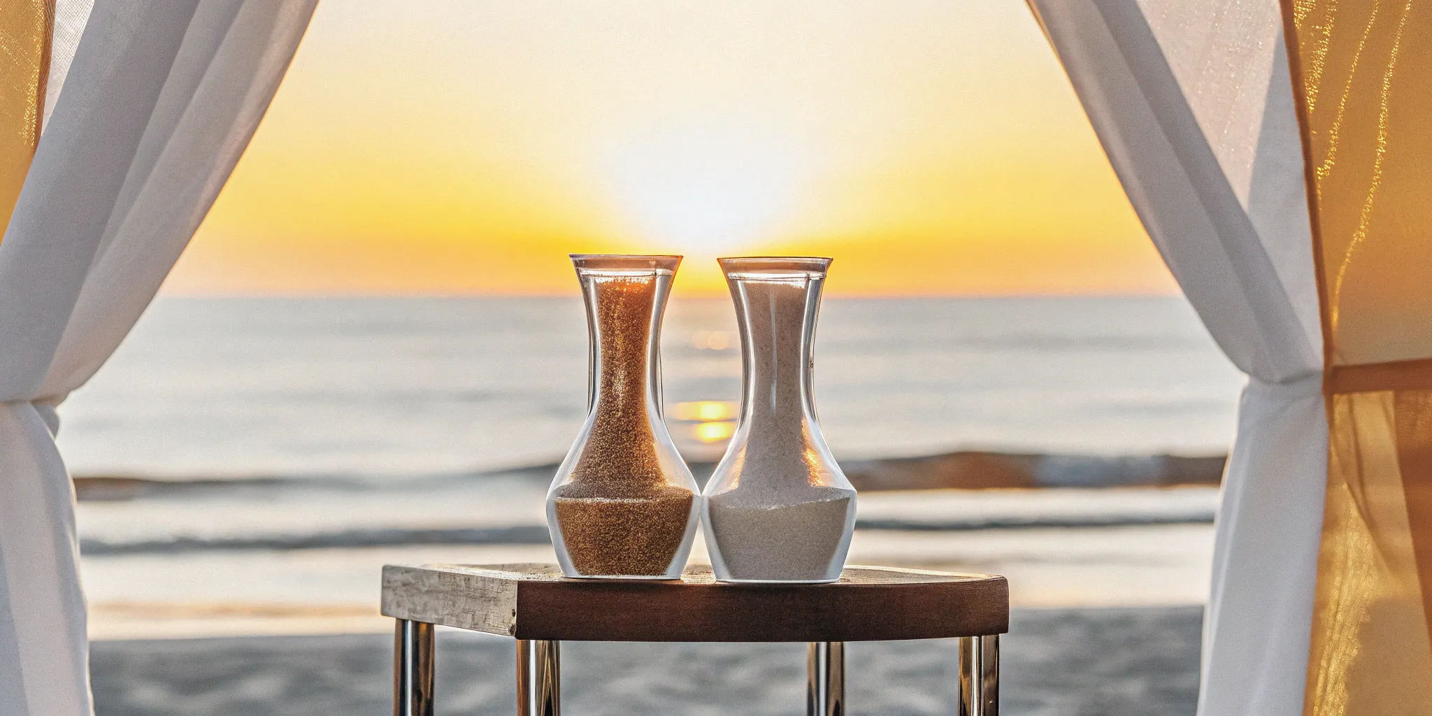 Vases of sand prepared for a wedding sand ceremony with personalized wording.