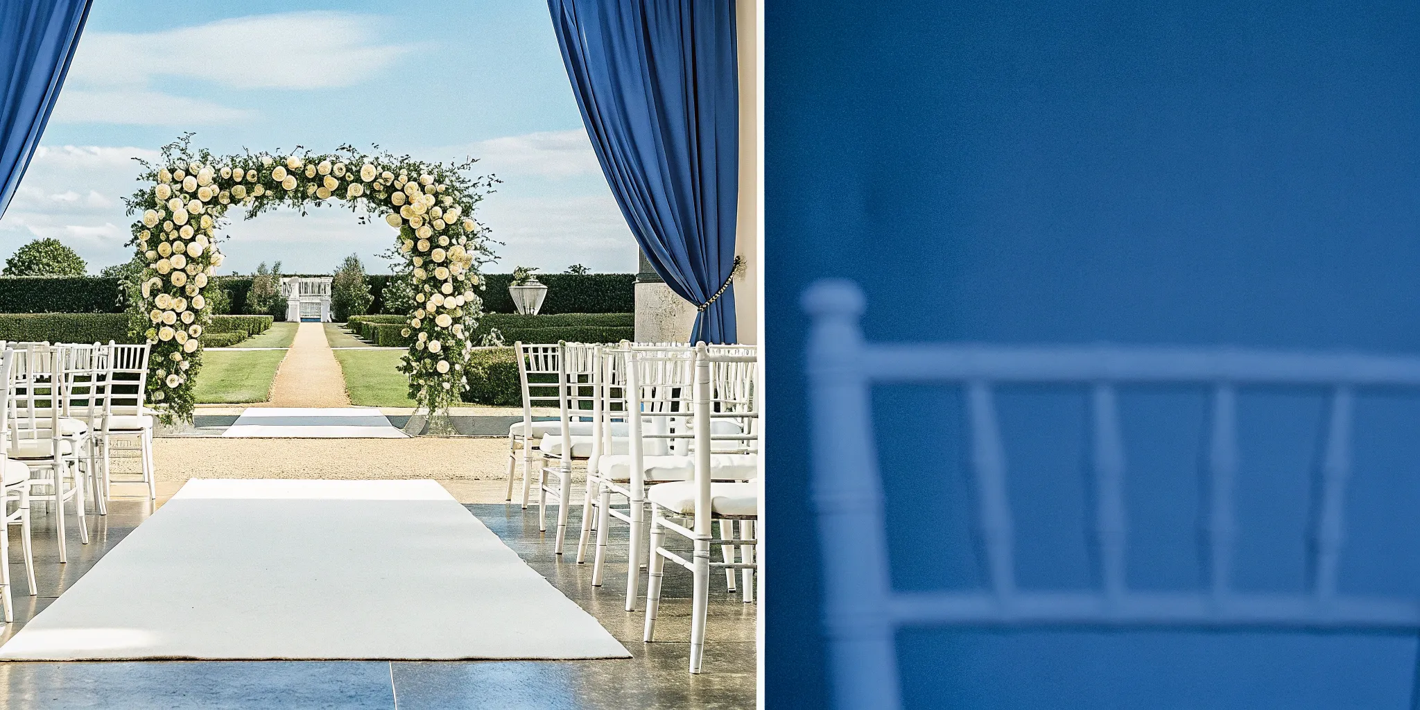 A classic wedding ceremony with a floral arch, ready for the vows and script.