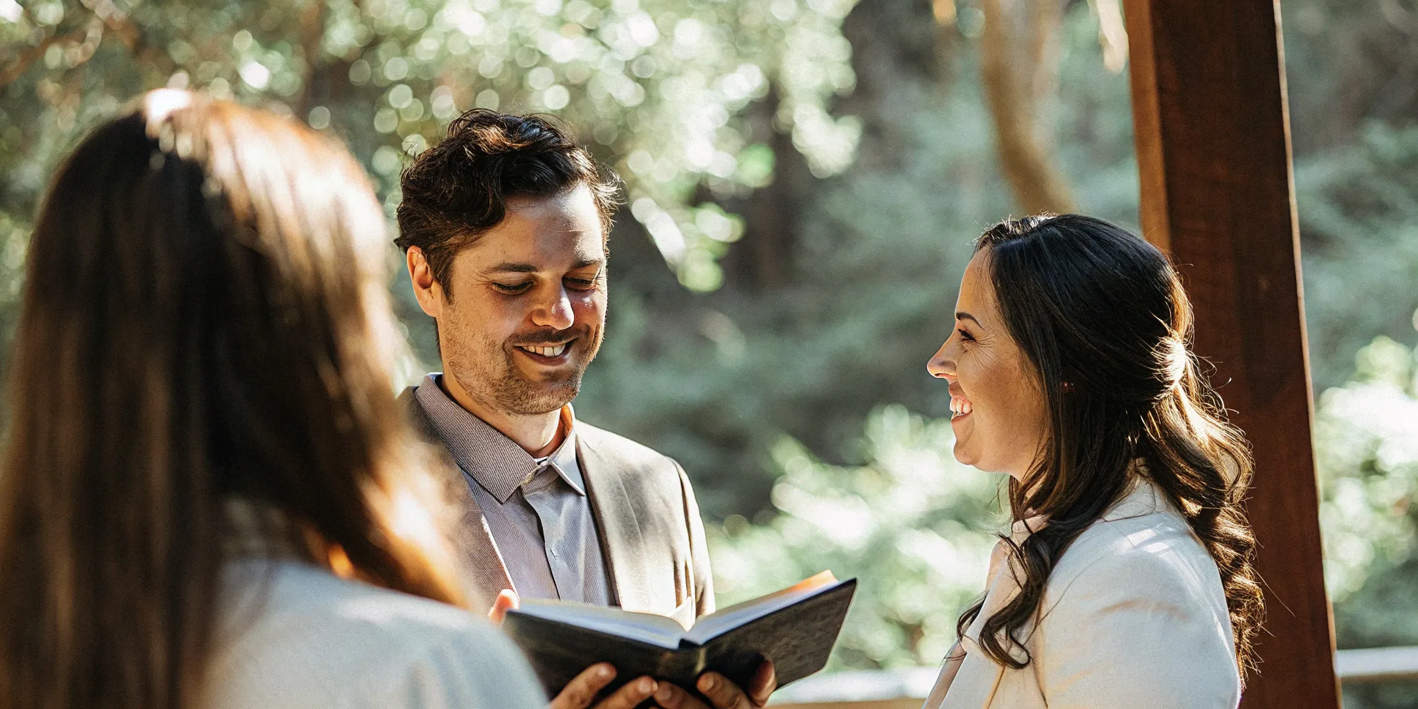 Wedding officiant welcoming guests with a speech at a wedding ceremony.