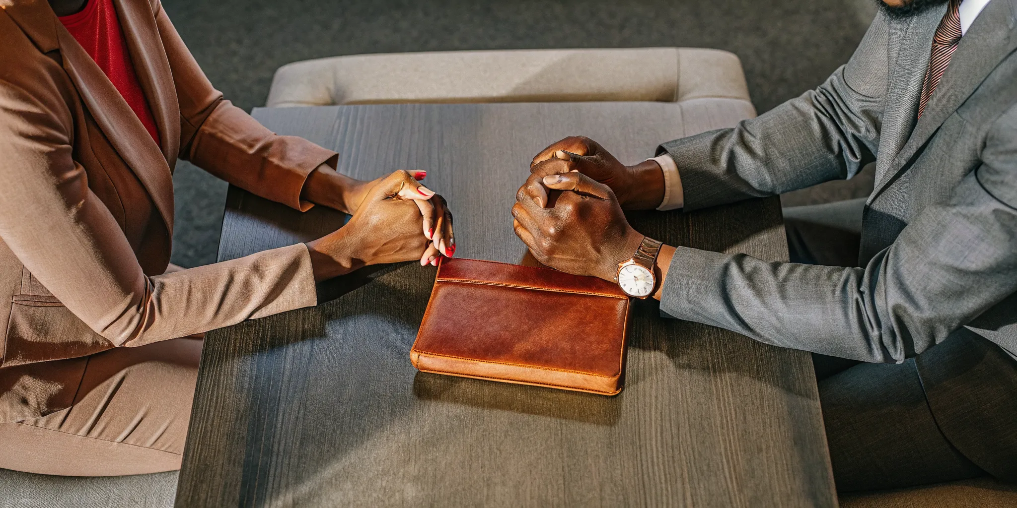 Two people discussing the legal differences between an ordained vs. licensed minister.