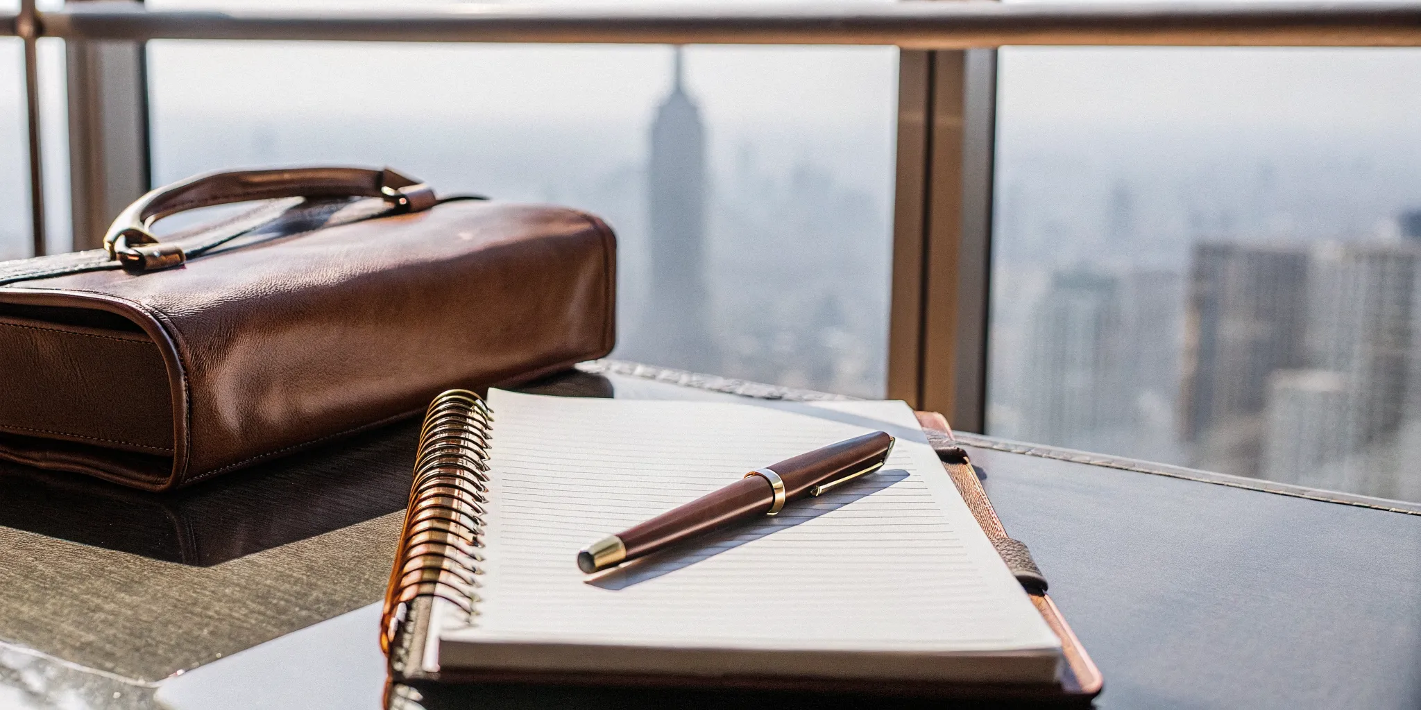 A desk with a notebook ready to fill out the New York one-day marriage officiant requirements.
