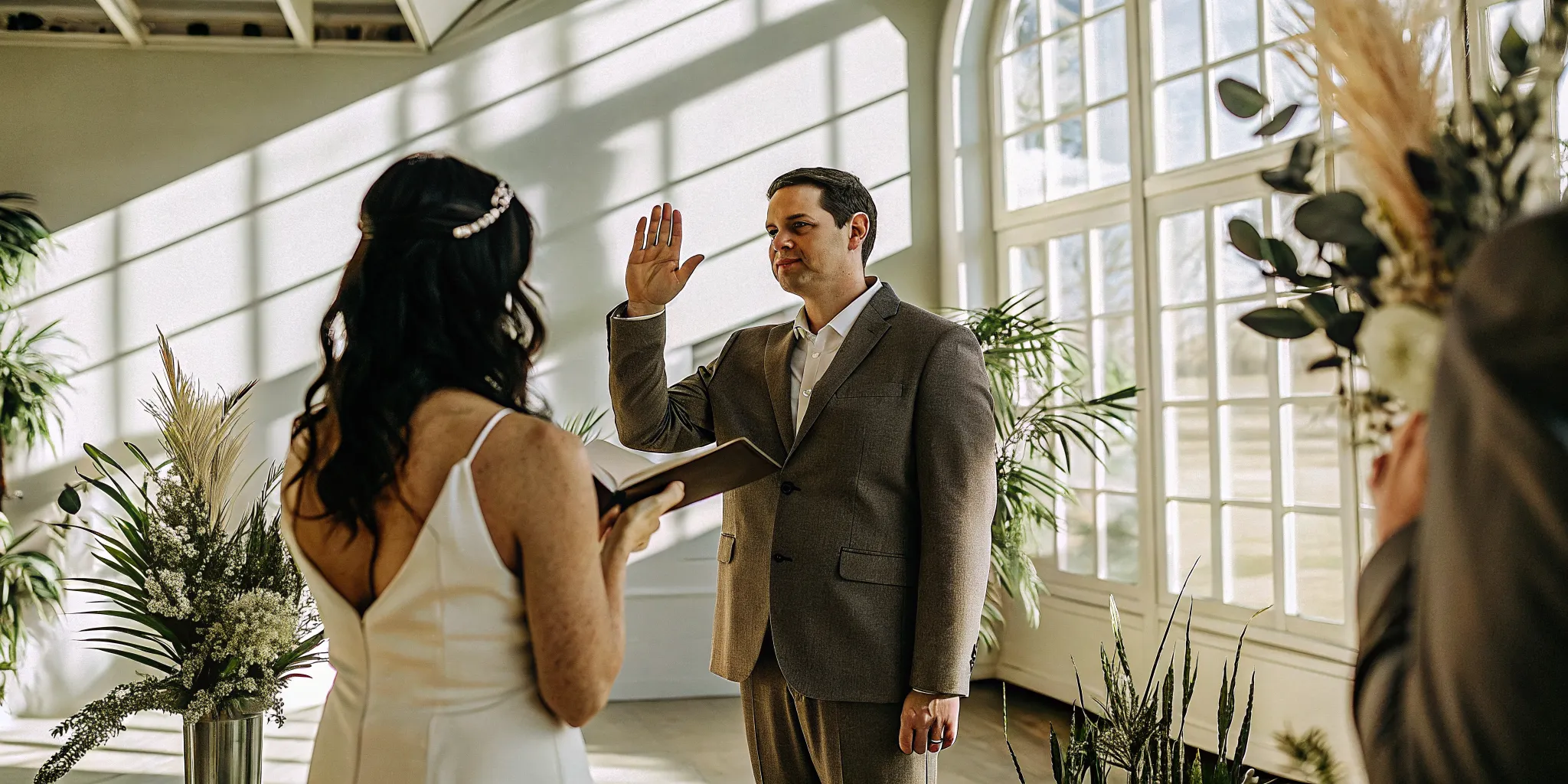 A wedding officiant introduces himself at the beginning of a wedding ceremony.