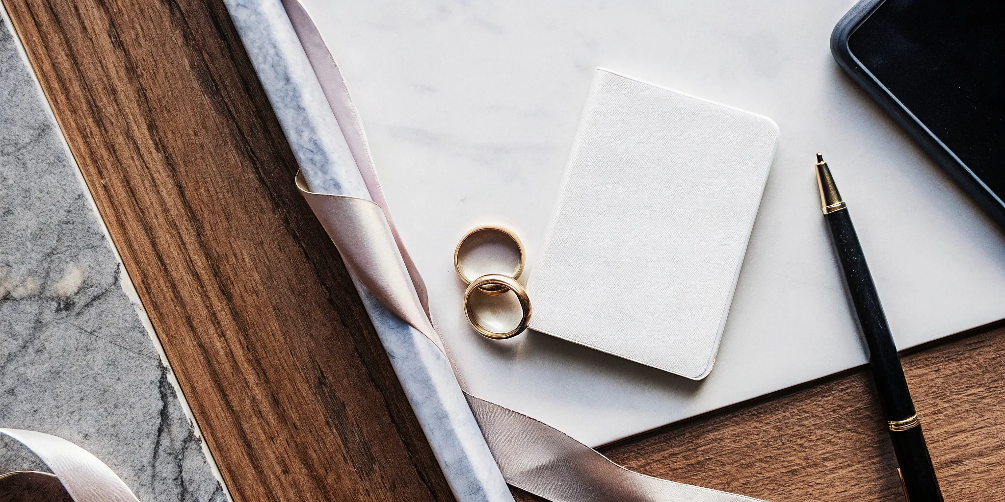 Wedding rings and a blank card for writing a short, sweet, non-religious wedding ceremony script.