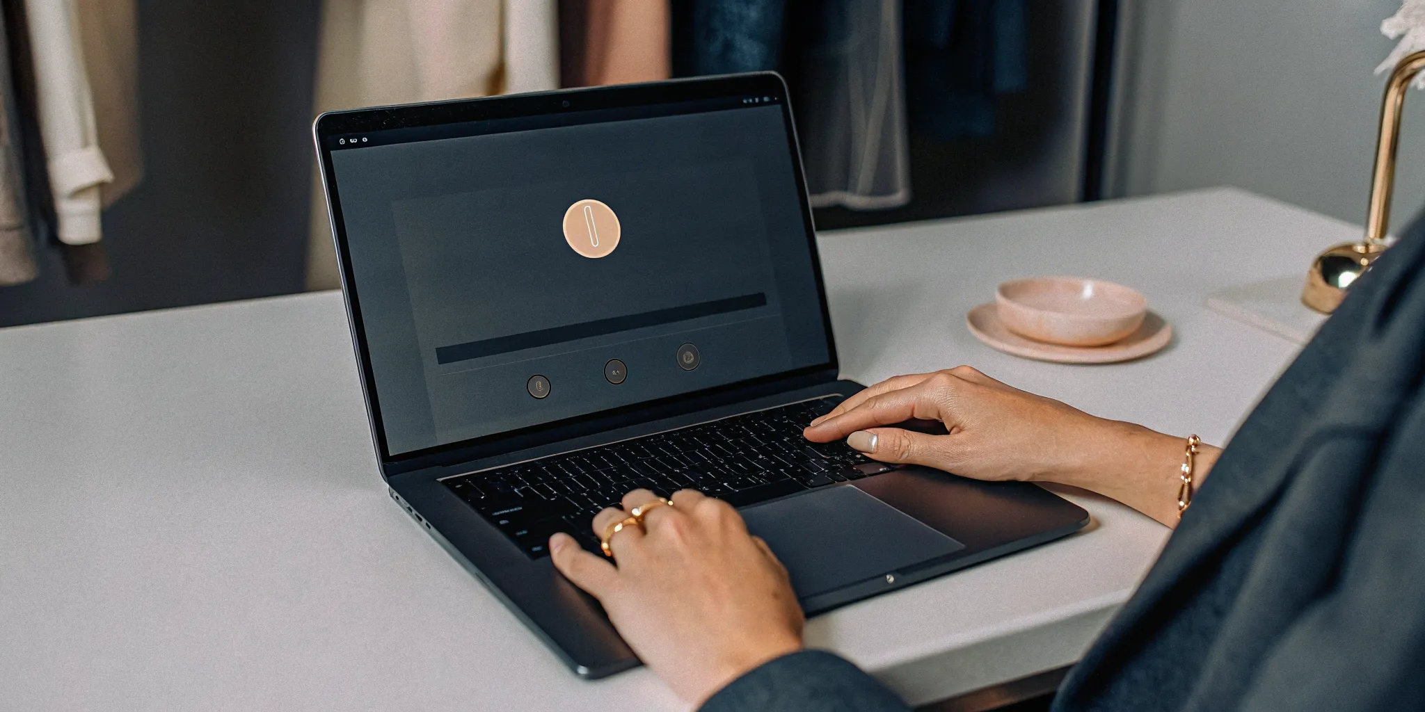 A person uses a laptop to get their online wedding officiant certification.