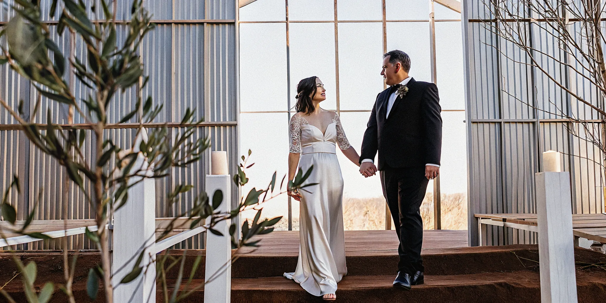 Priscilla Shirer and her husband Jerry holding hands during their meaningful wedding.