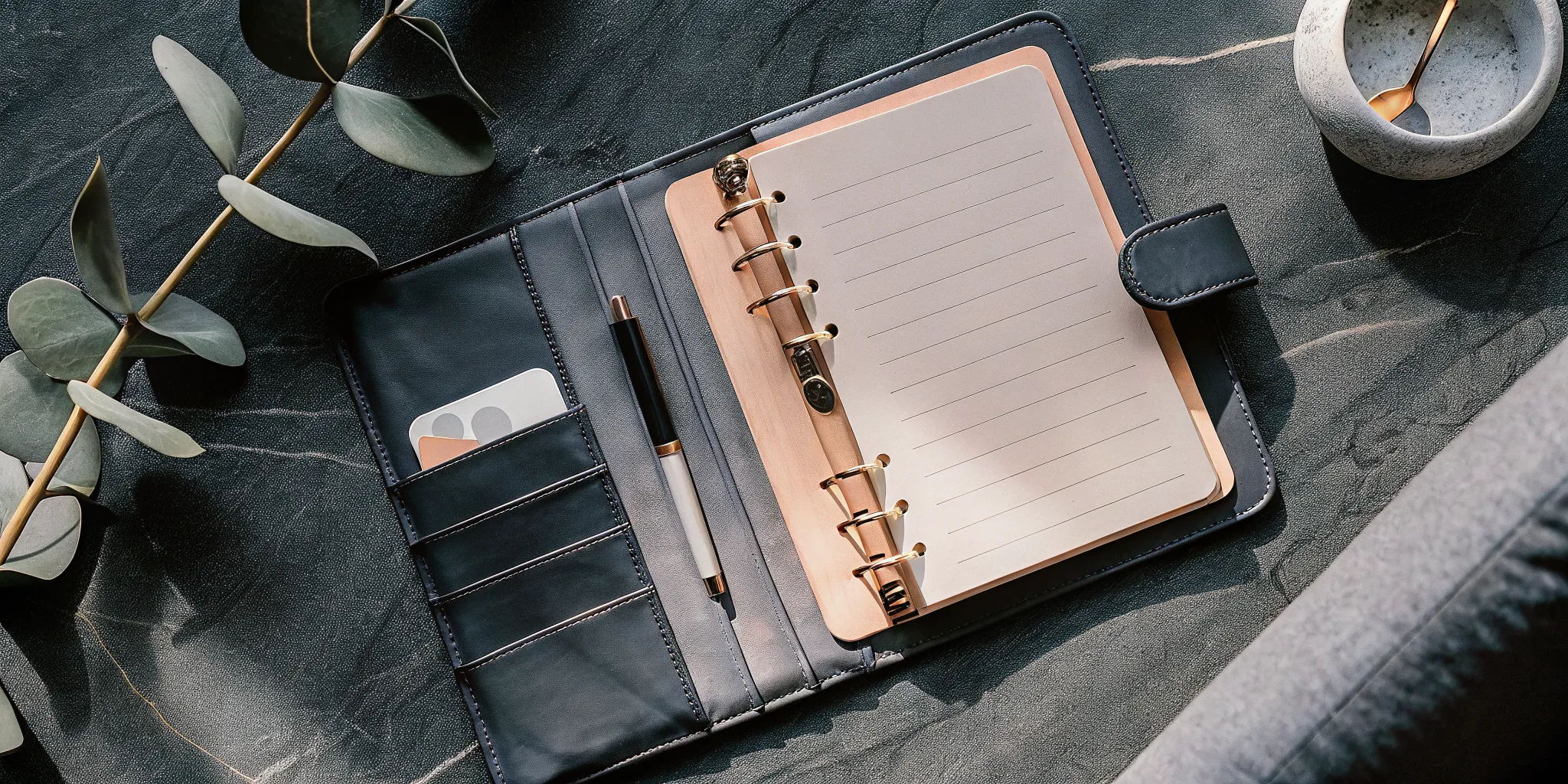 A wedding officiant script template laid out on a table with a pen for planning a ceremony.