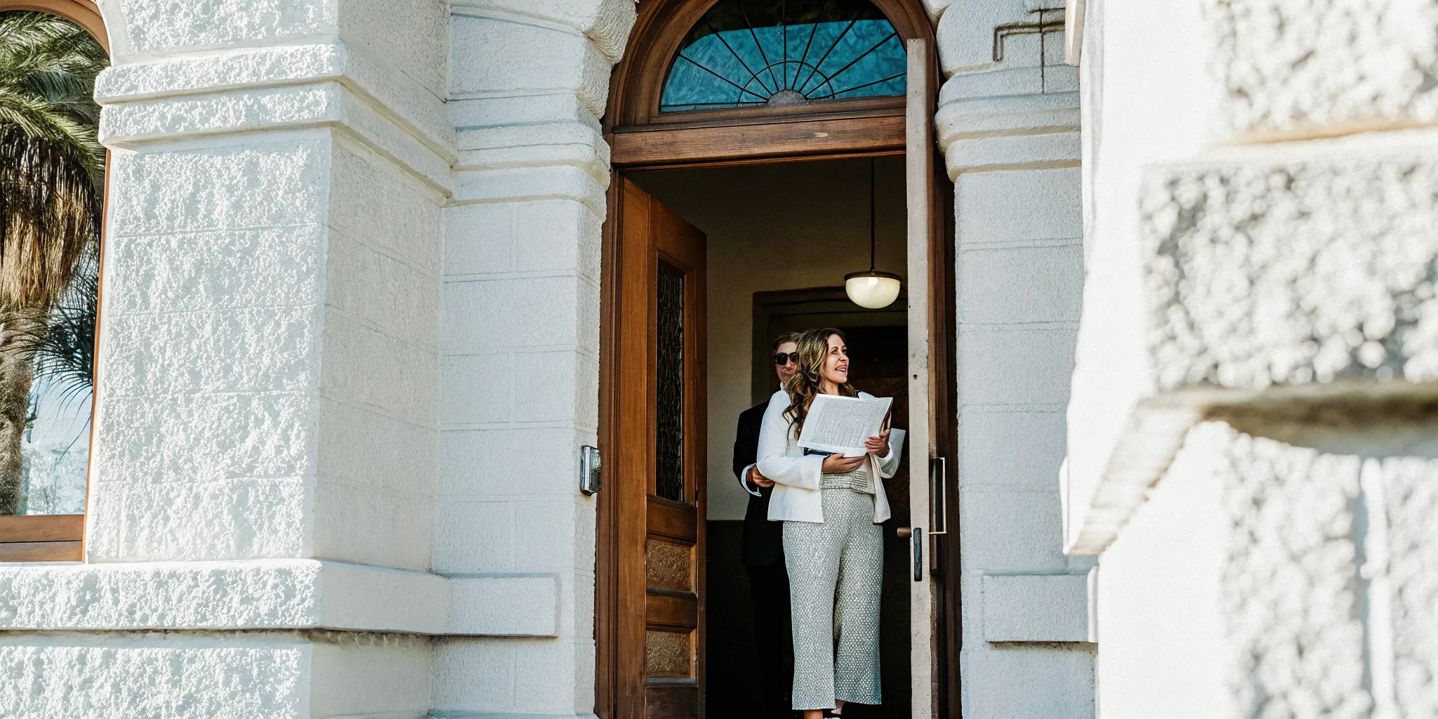 A professional ordained minister holding an official ordination certificate outside a municipal building in Phoenix Arizona.
