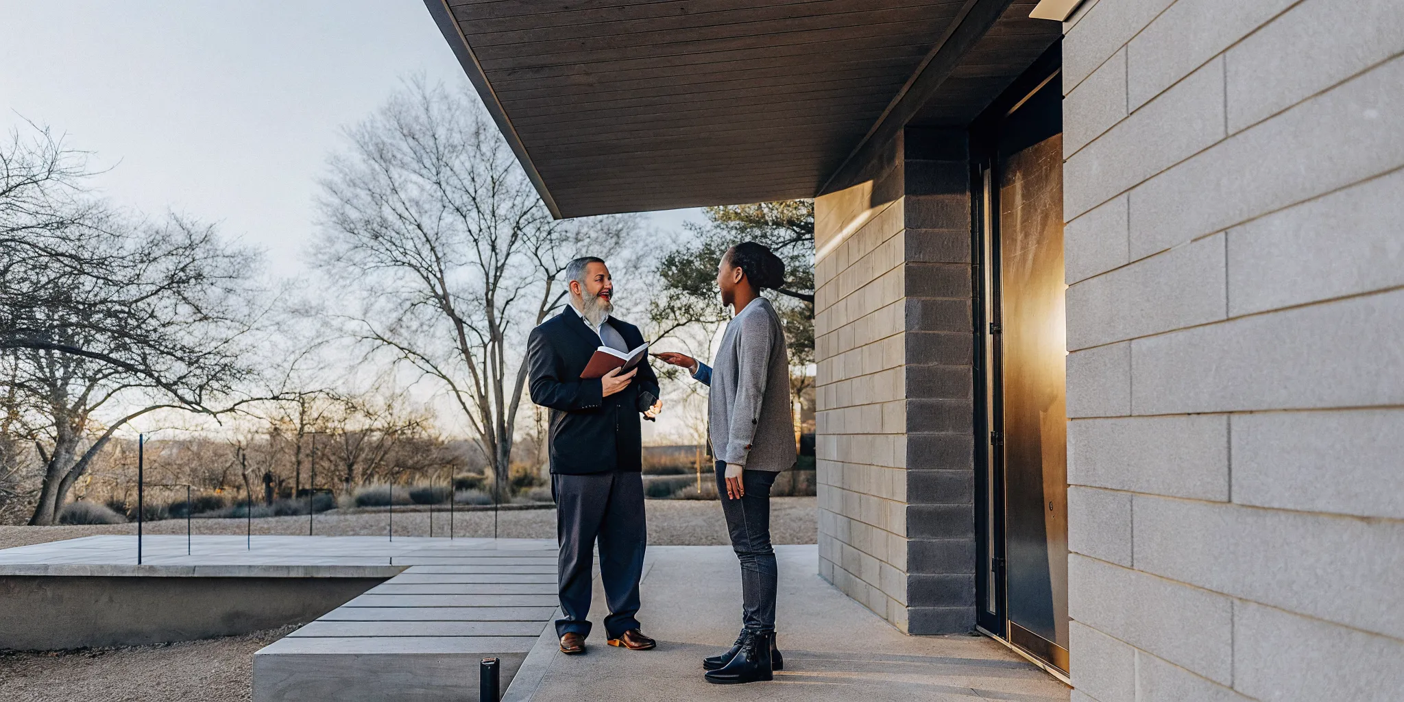 Ordained minister standing outside a modern Austin venue with warm sunset lighting