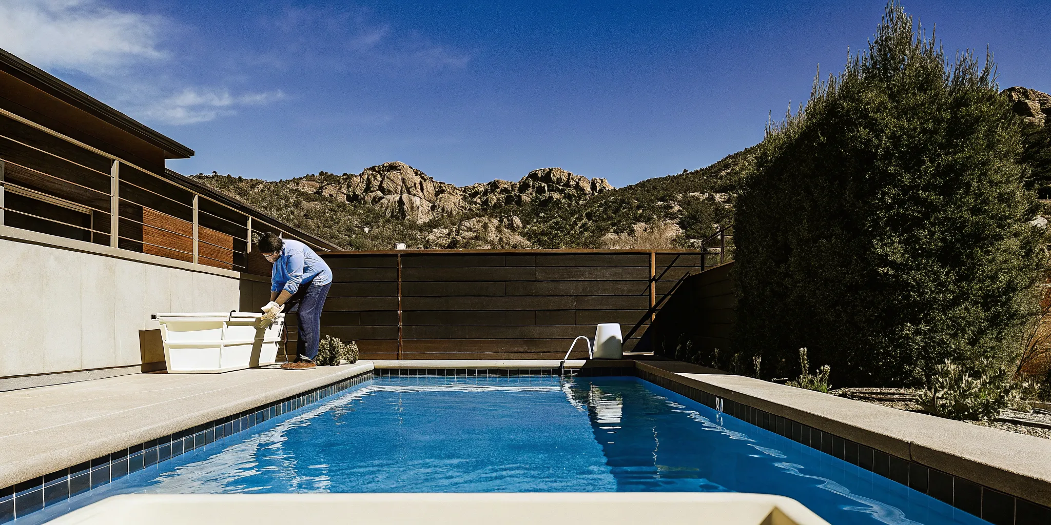 Pool technician testing water chemistry at a Colorado pool