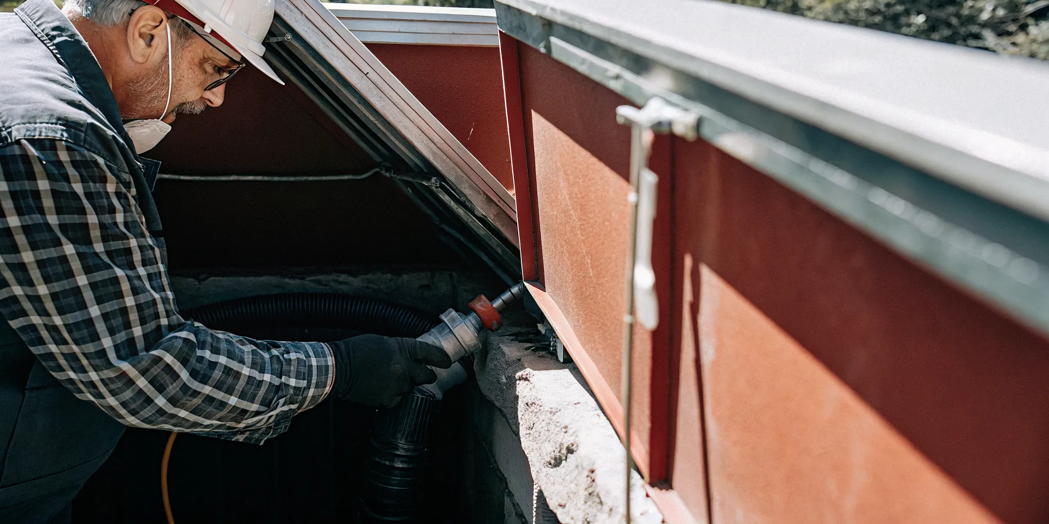 Pool technician inspecting equipment during a Colorado pool opening