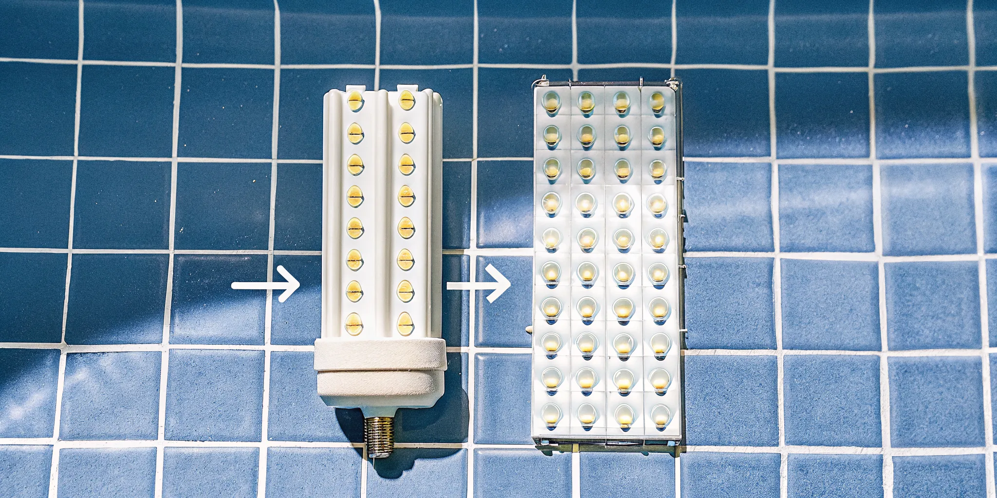 LED pool light bulb next to a standard incandescent pool bulb showing size differences and connector types