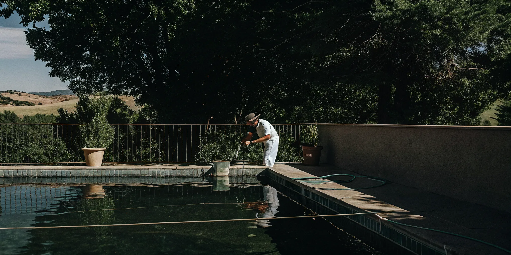 Pool technician testing water at a Denver residential pool