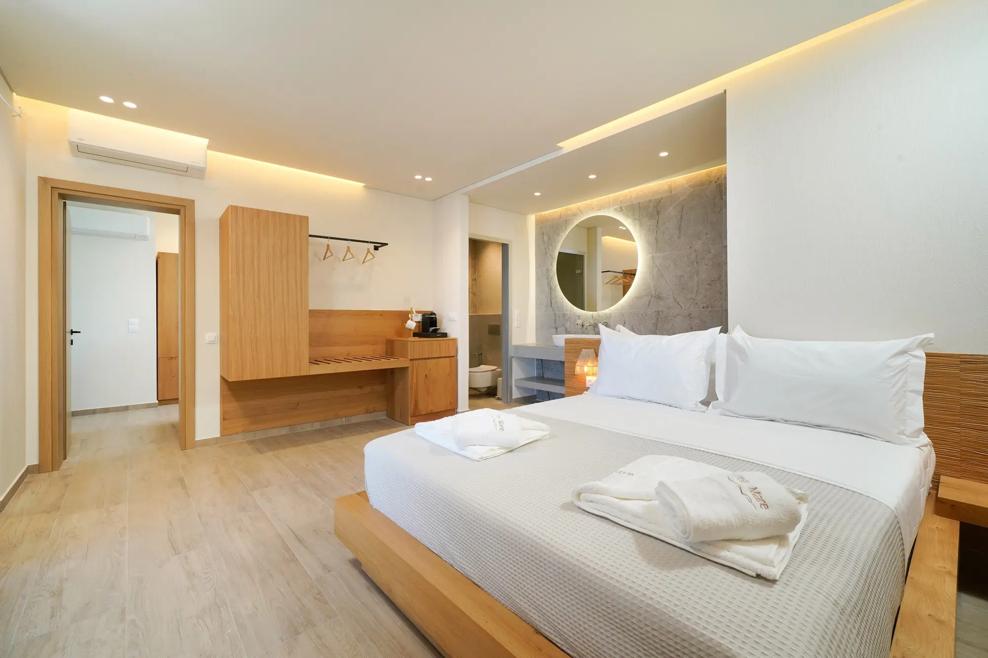 King bedroom with COCO-MAT bed, wood wardrobe and open marble ensuite | Bedroom