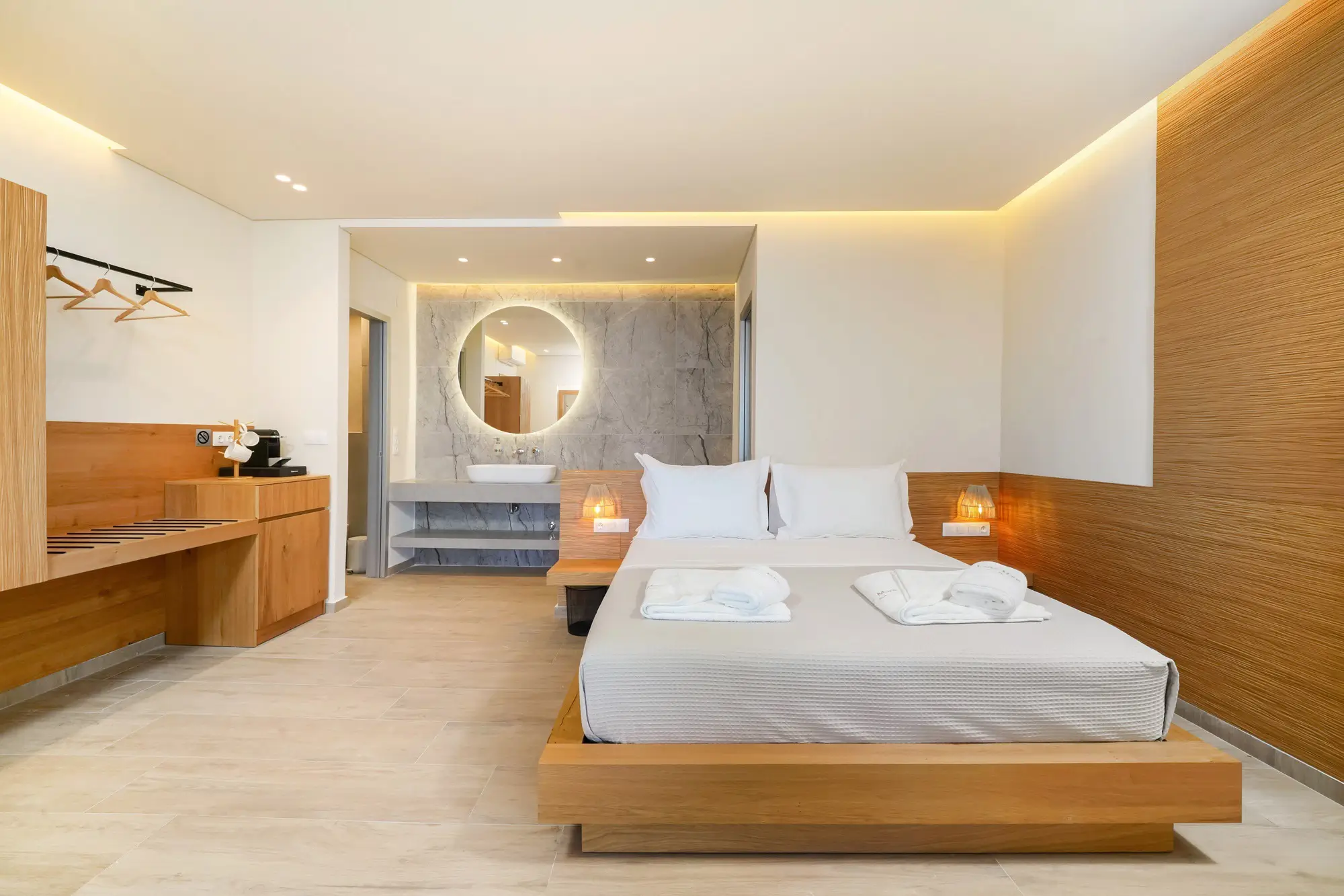 King bedroom with COCO-MAT bed, warm wood joinery and open marble ensuite | Bedroom