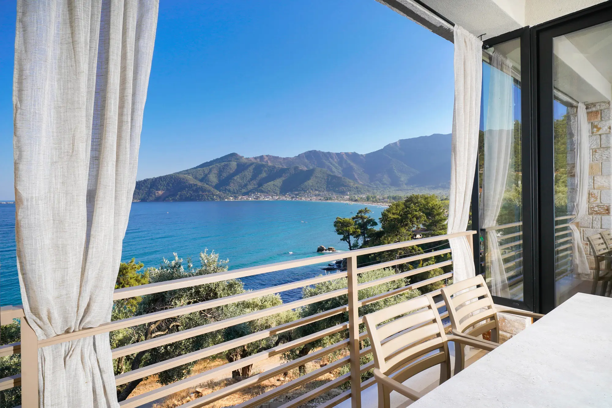 Private terrace view over Aegean bay with Thassos coastline and mountains | Terrace