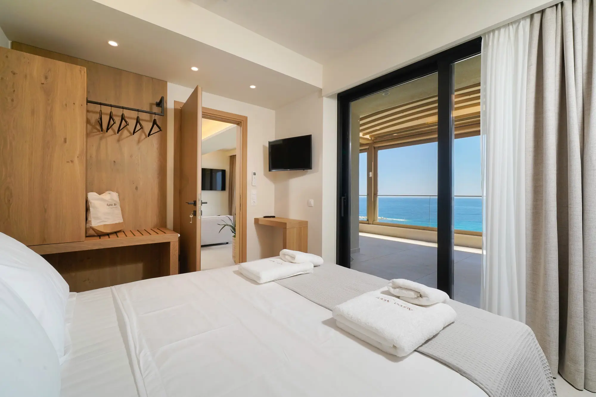 King bedroom with COCO-MAT bed, oak headboard and sea-view terrace door | Bedroom