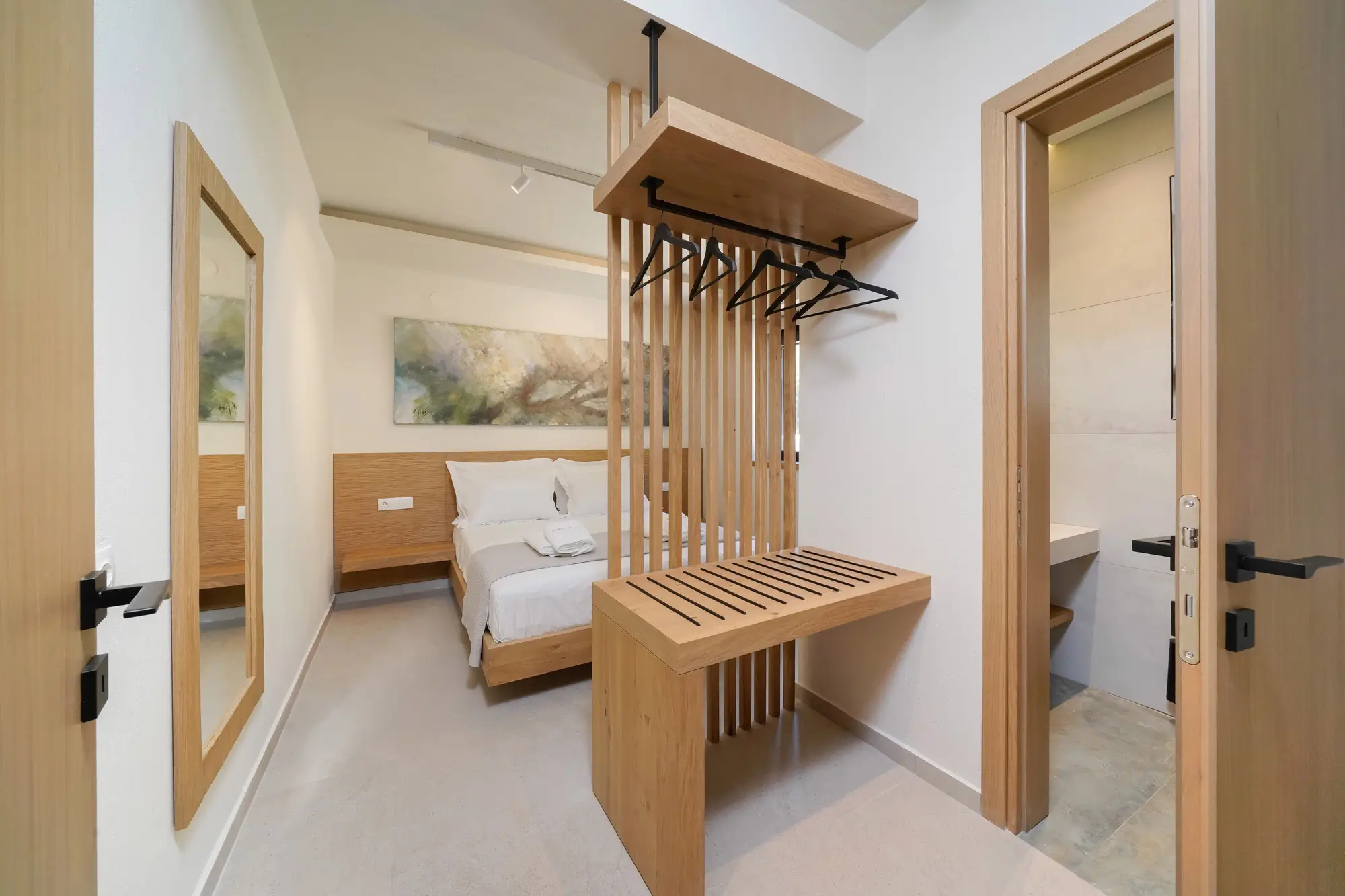 Bedroom two with COCO-MAT king bed, TV unit and hillside window | Bedroom