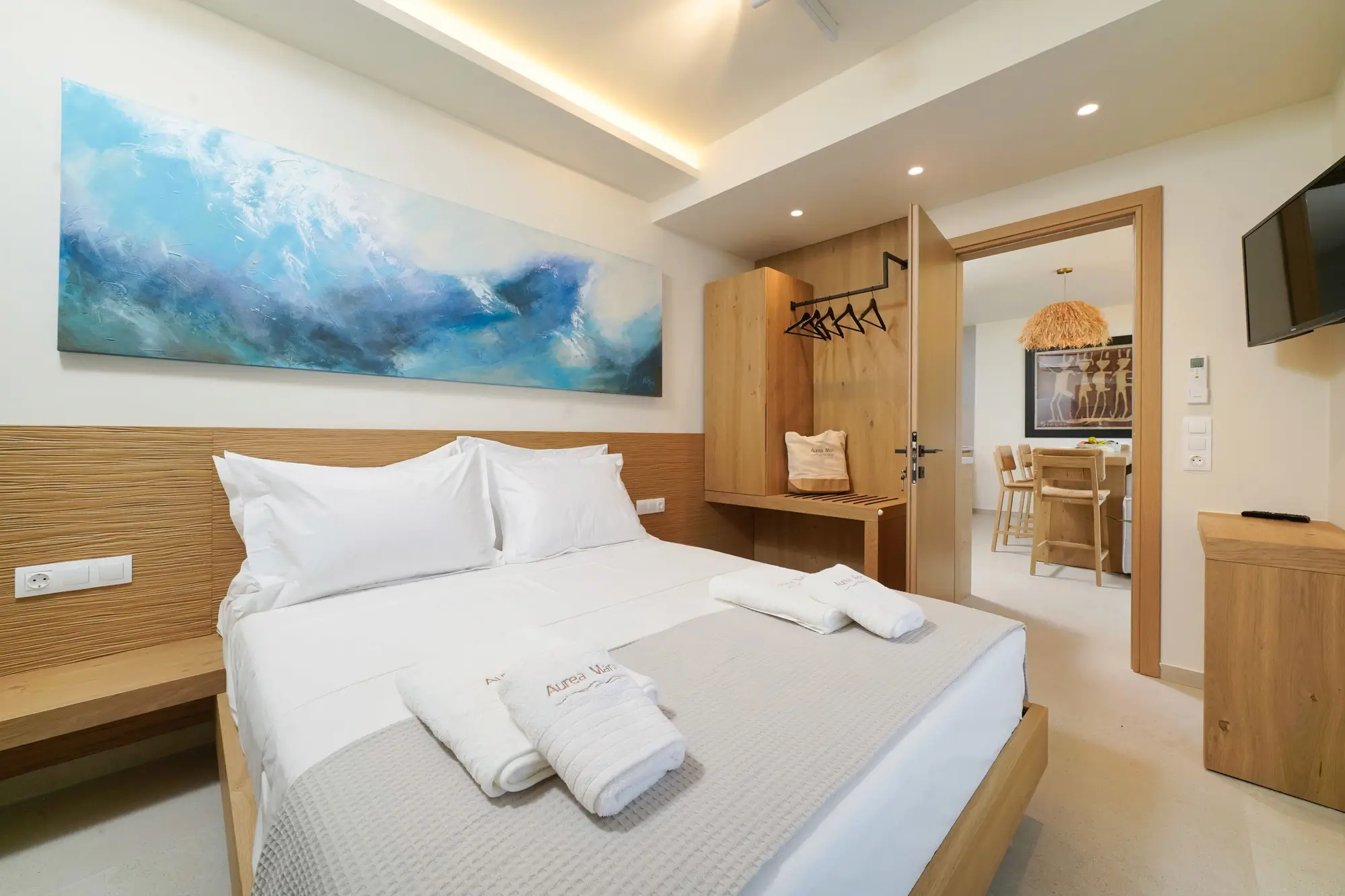 Bedroom one with COCO-MAT king bed, oak frame and sea-view terrace door | Bedroom