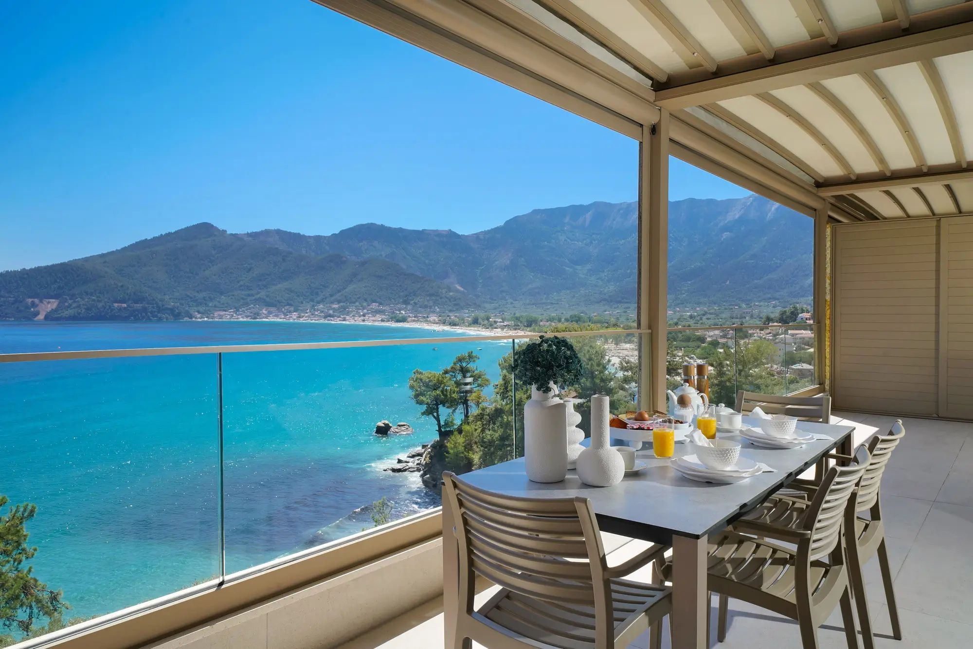 Indoor kitchen with oak cabinetry, stone worktops and matte black fittings | Kitchen