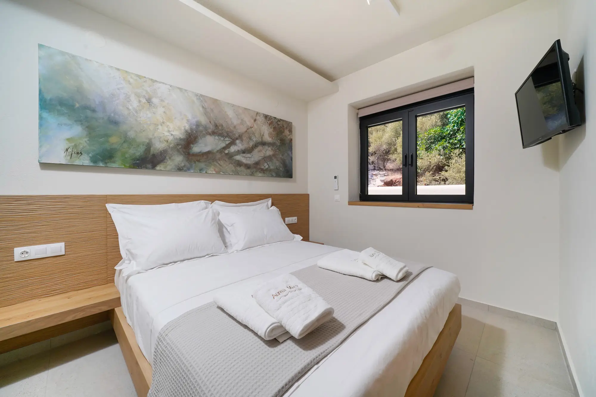 King bedroom with COCO-MAT bed, TV panel and hillside garden window | Bedroom