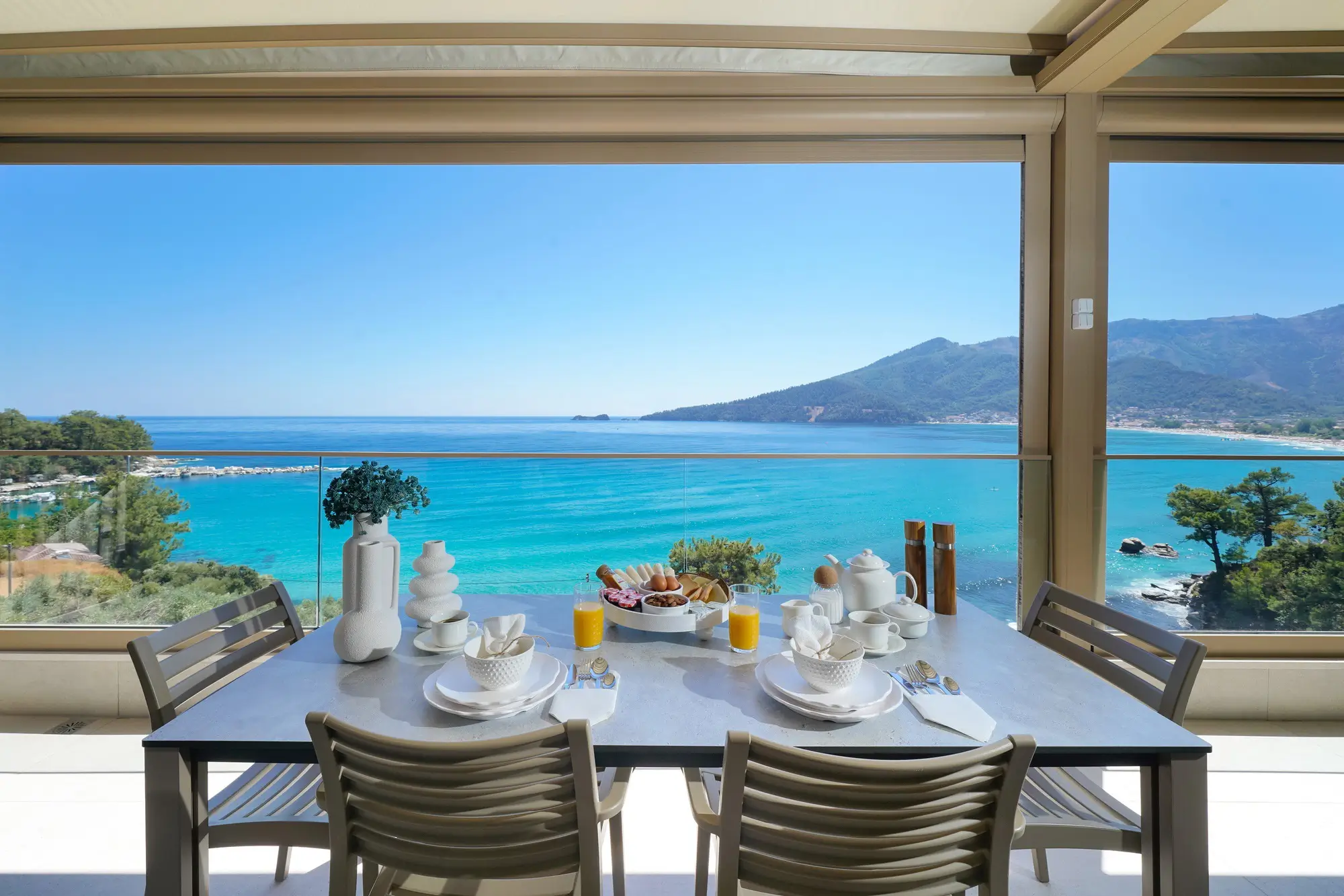 Open-plan kitchen and dining with full-width sea view and oak dining table | Living Area