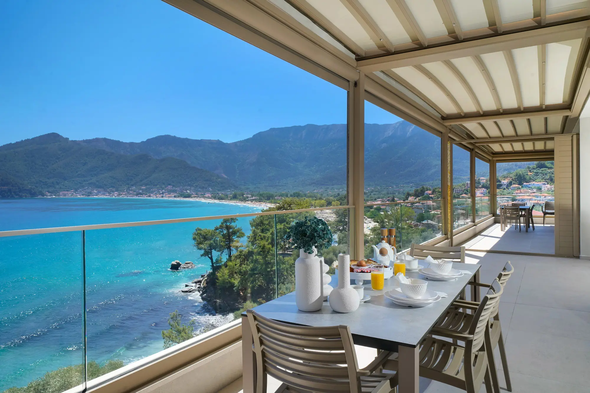 Aurea Grand Residence terrace with louvred pergola and Golden Beach panorama below | Suite