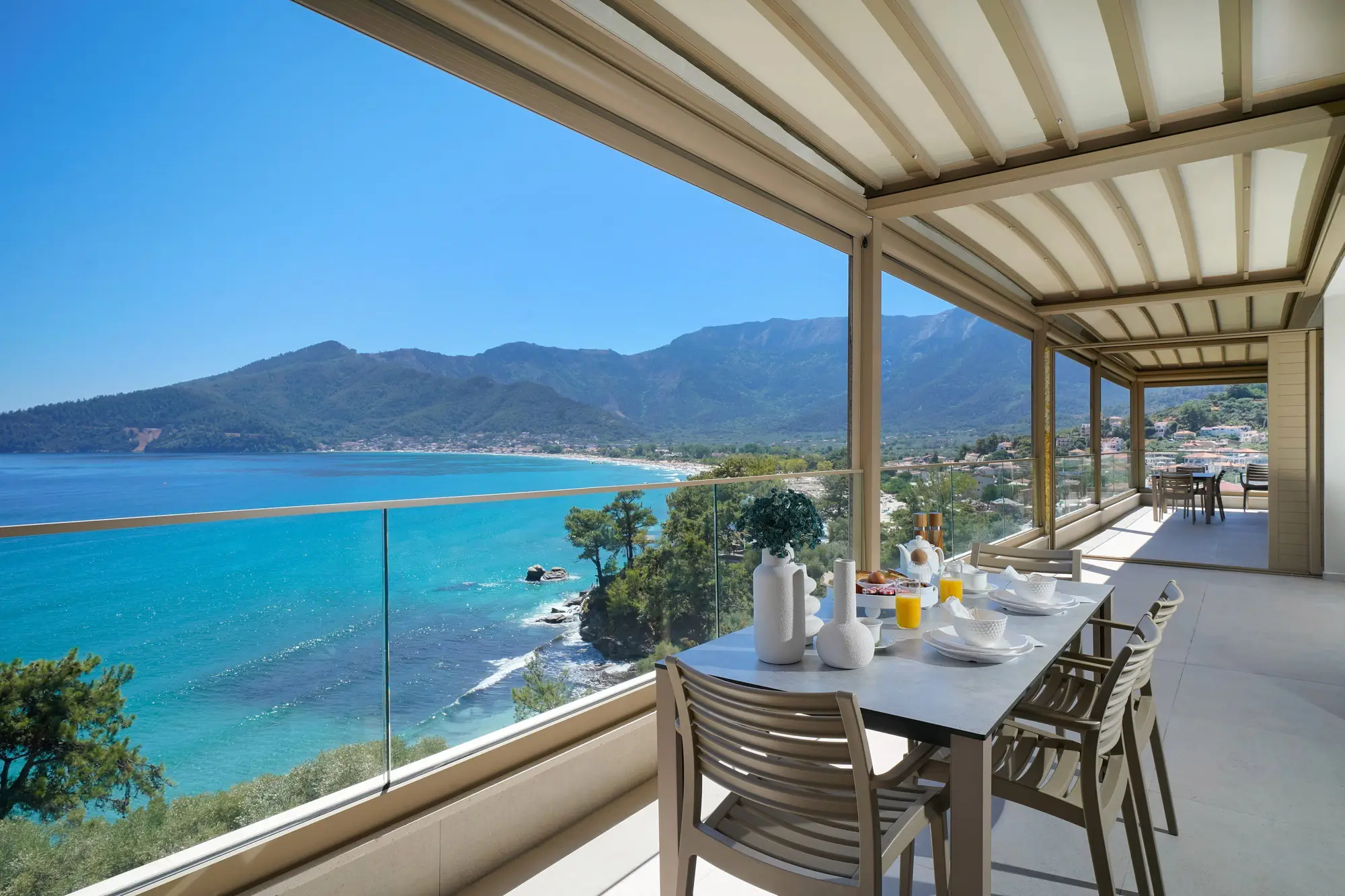 Grand Residence terrace dining table with Aegean sea and Mount Ipsarion panorama | Terrace