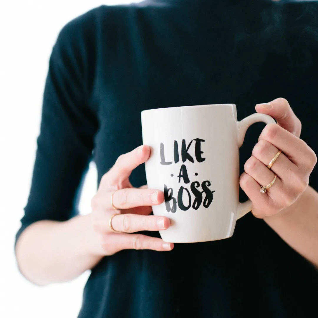 A woman holding a mug
