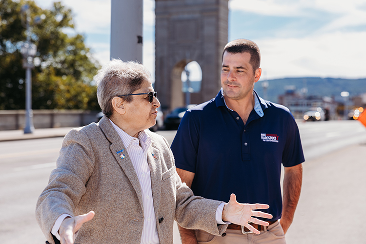 Denise Thomas speaking with Mike Harostock on the Market Street Bridge.
