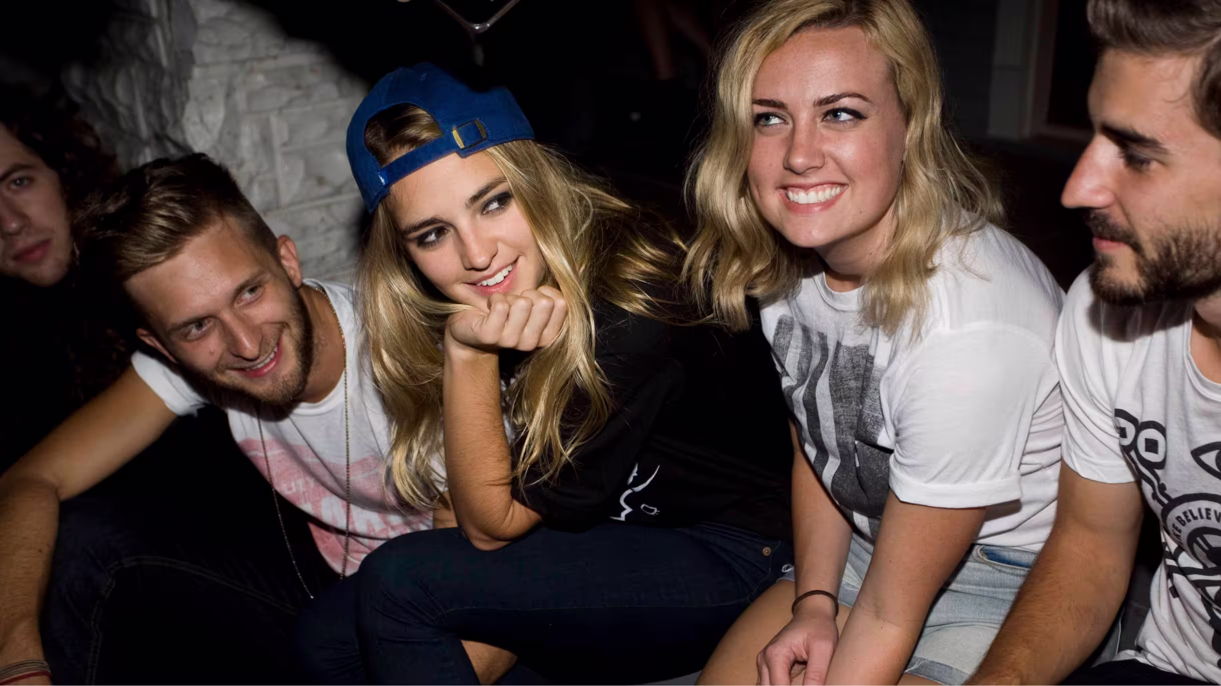 Group of friends wearing Make Believe apparel indoors